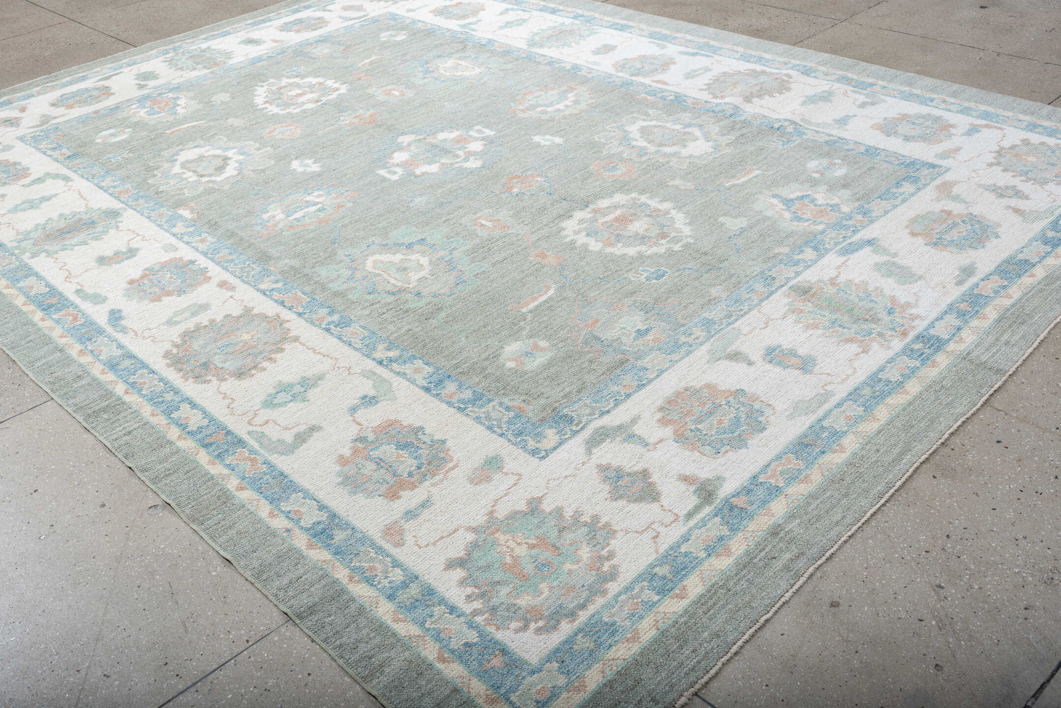 9' x 12' one-of-a-kind handmade vintage Oushak large size rug. Color palette: gray, ivory, sky blue, sage, blush, taupe