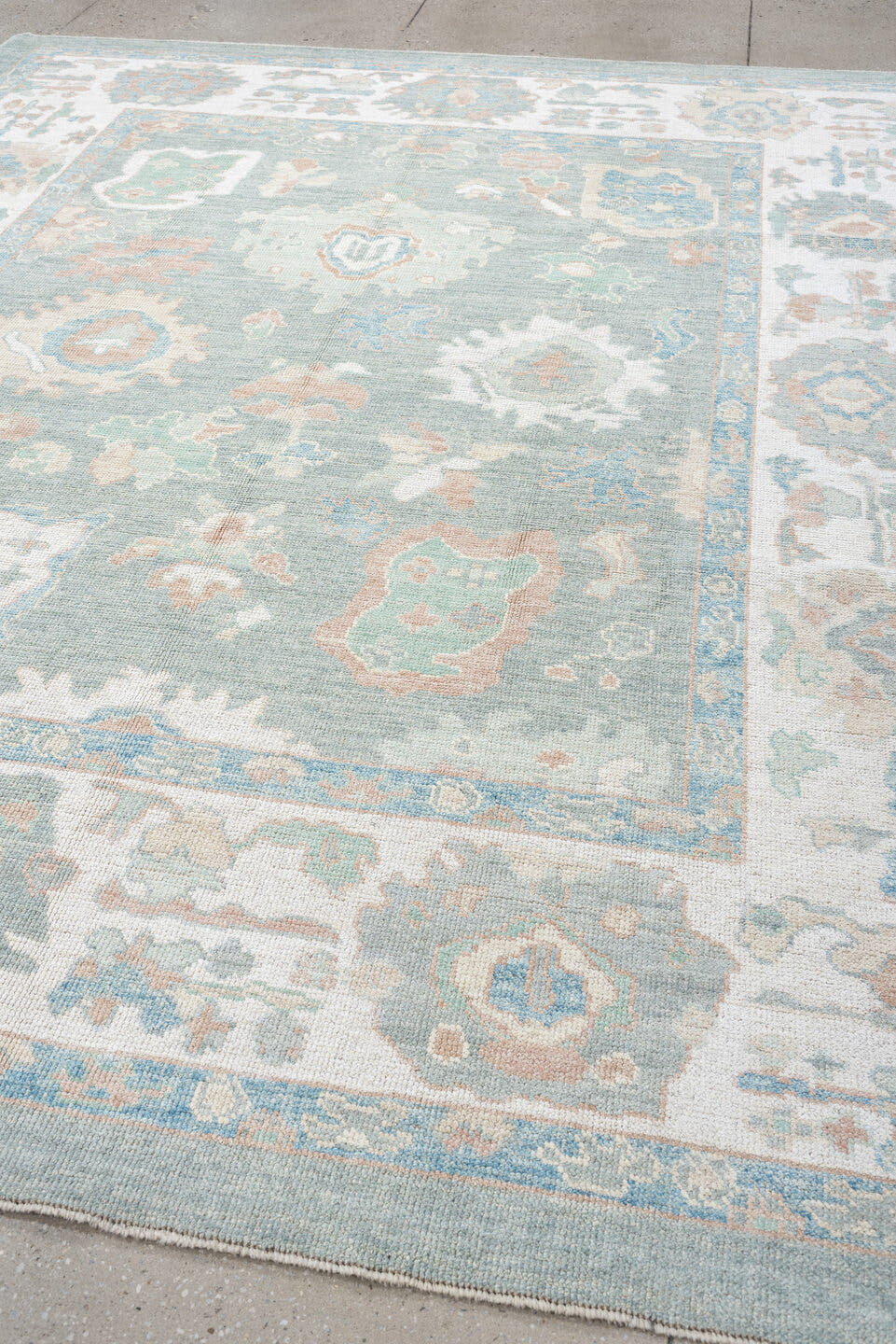 8' x 10' one-of-a-kind handmade vintage Oushak large size rug. Color palette: aqua, ivory, peach, sage, taupe, cream, teal