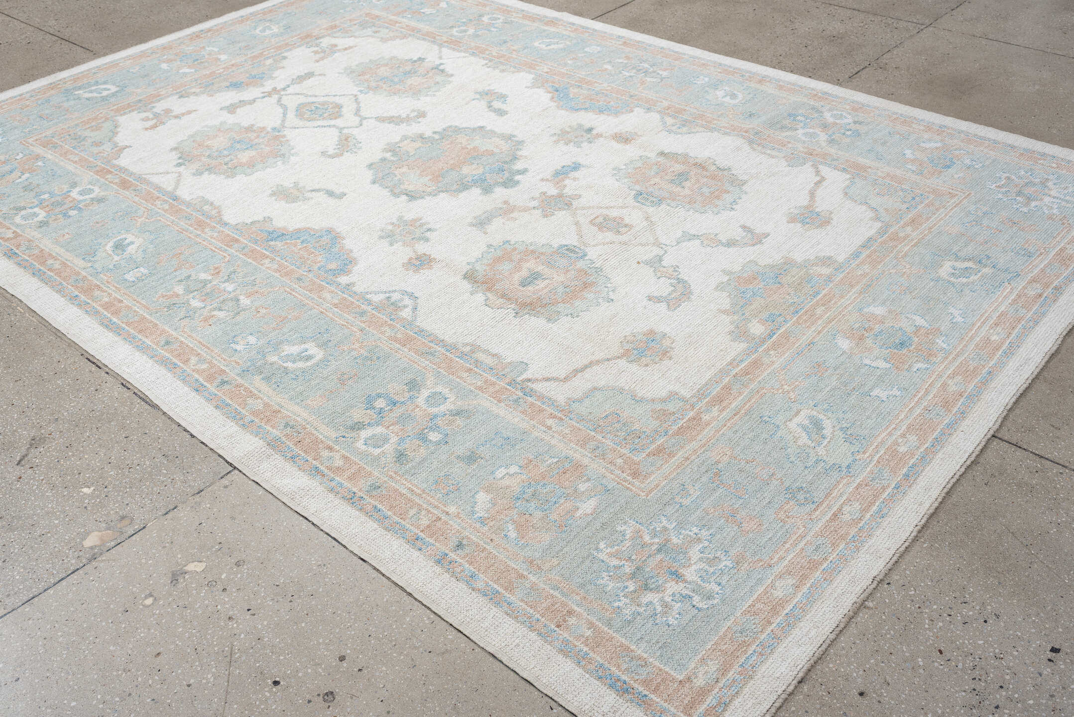 7' x 10' one-of-a-kind handmade vintage Oushak large size rug. Color palette: ivory, pale aqua, blush, taupe, cream, teal