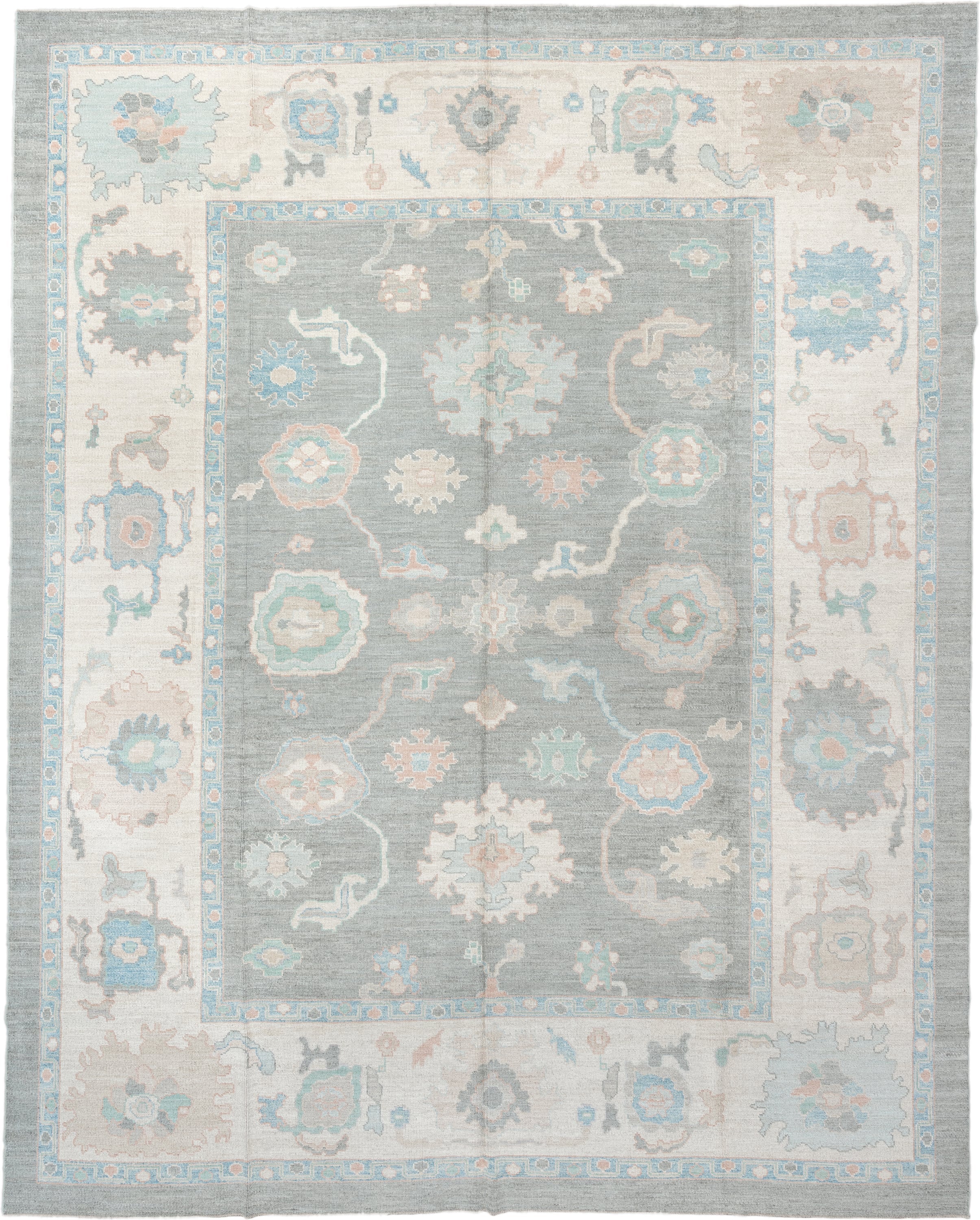 12' x 15' one-of-a-kind handmade vintage Oushak oversize rug. Color palette: pale blue, ivory, taupe, peach, sage, charcoal