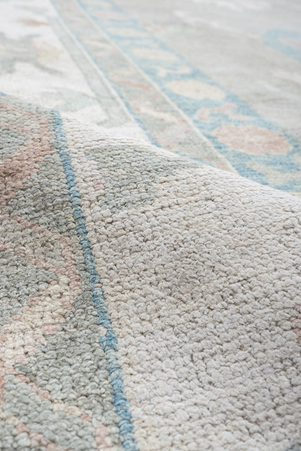 12' x 15' one-of-a-kind handmade vintage Oushak oversize rug. Color palette: pale gray, ivory, sky blue, peach, taupe, sage