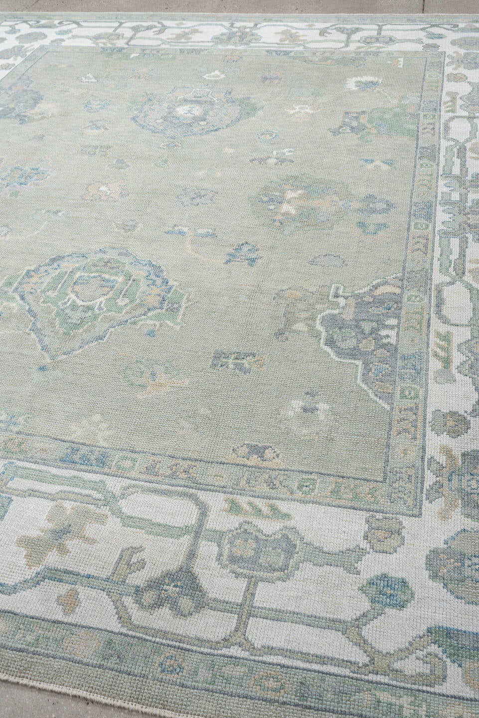 8' x 9' one-of-a-kind handmade vintage Oushak large size rug. Color palette: taupe, ivory, sky blue, sage, soft gold