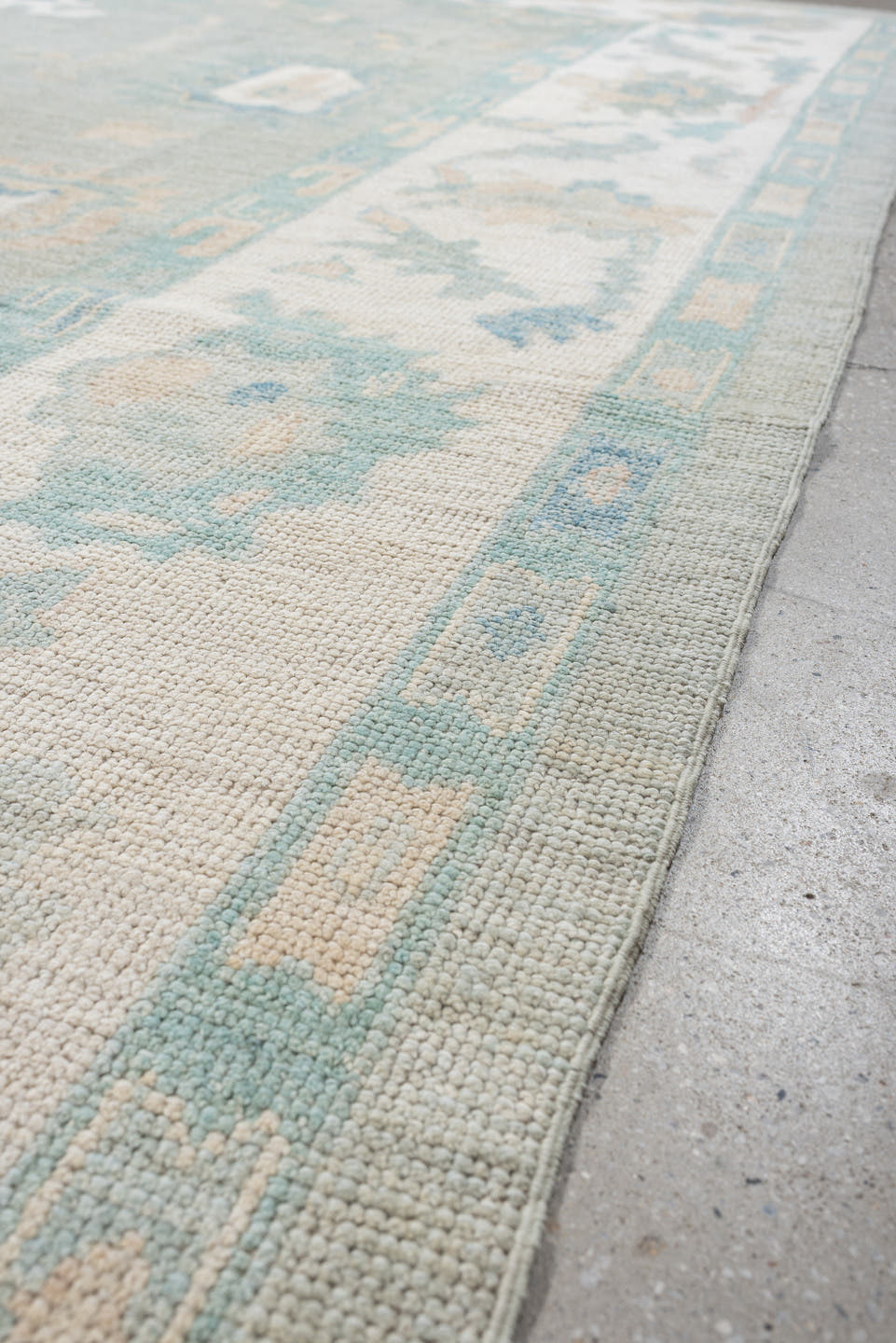 8' x 10' one-of-a-kind handmade vintage Oushak large size rug. Color palette: pale aqua, ivory, sky blue, taupe, cream, sage