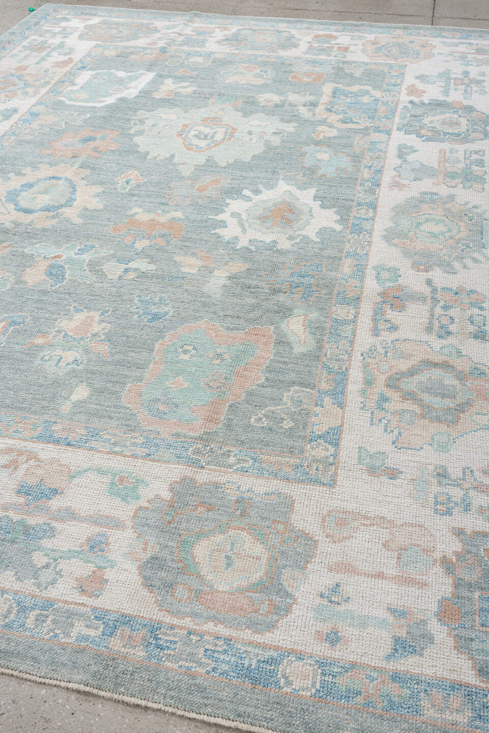 7' x 10' one-of-a-kind handmade vintage Oushak large size rug. Color palette: pale blue, ivory, sage, blush, taupe