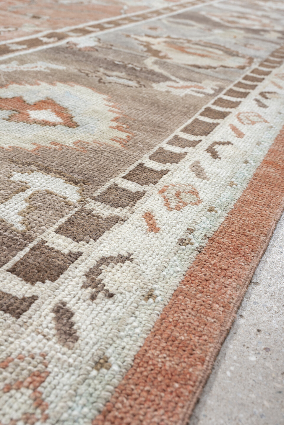 9' x 13' one-of-a-kind handmade vintage Oushak large size rug. Color palette: blush, taupe, ivory, pale blue, peach, sand