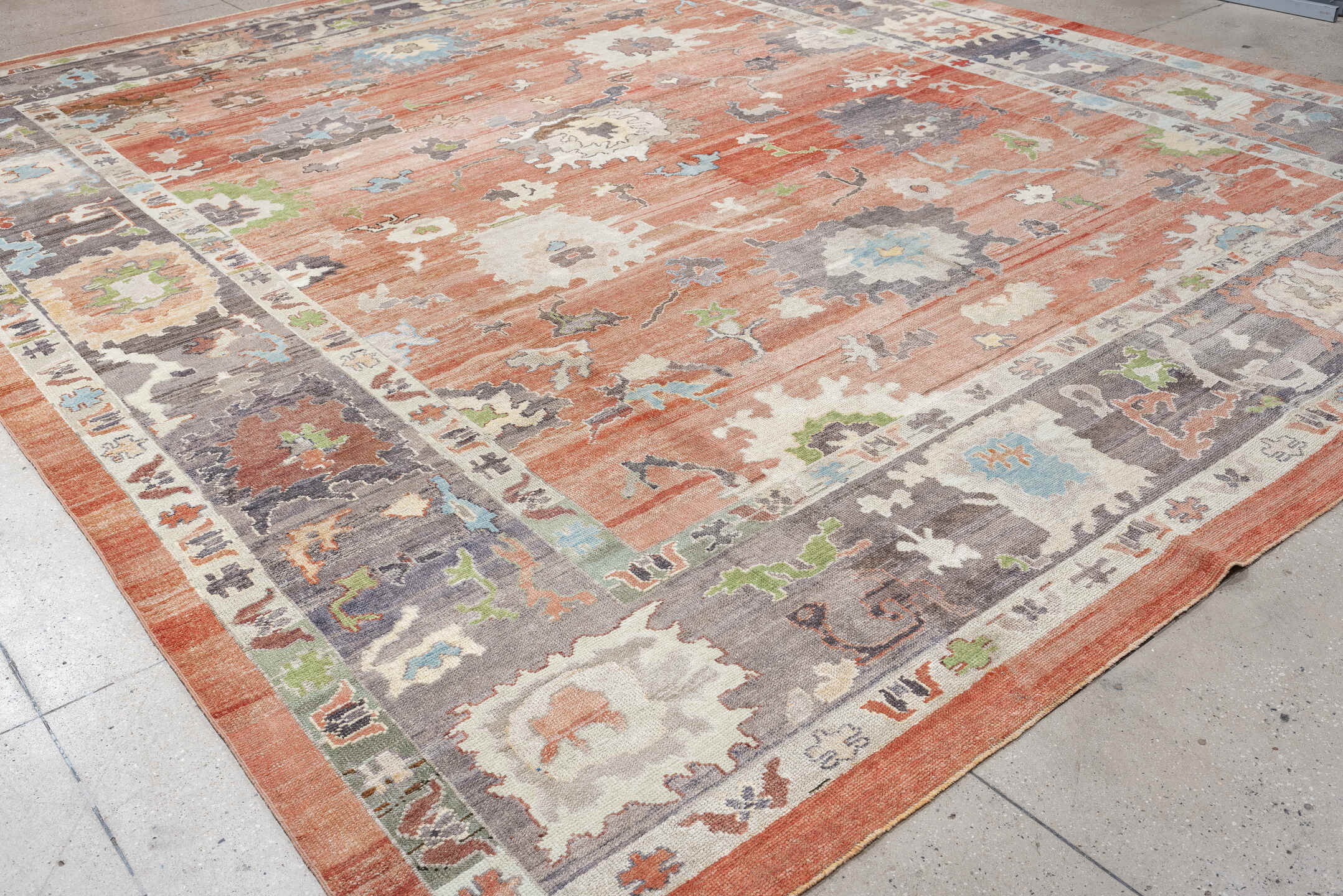 12' x 15' one-of-a-kind handmade vintage Oushak oversize rug. Color palette: coral, slate, ivory, sky blue, sage, taupe