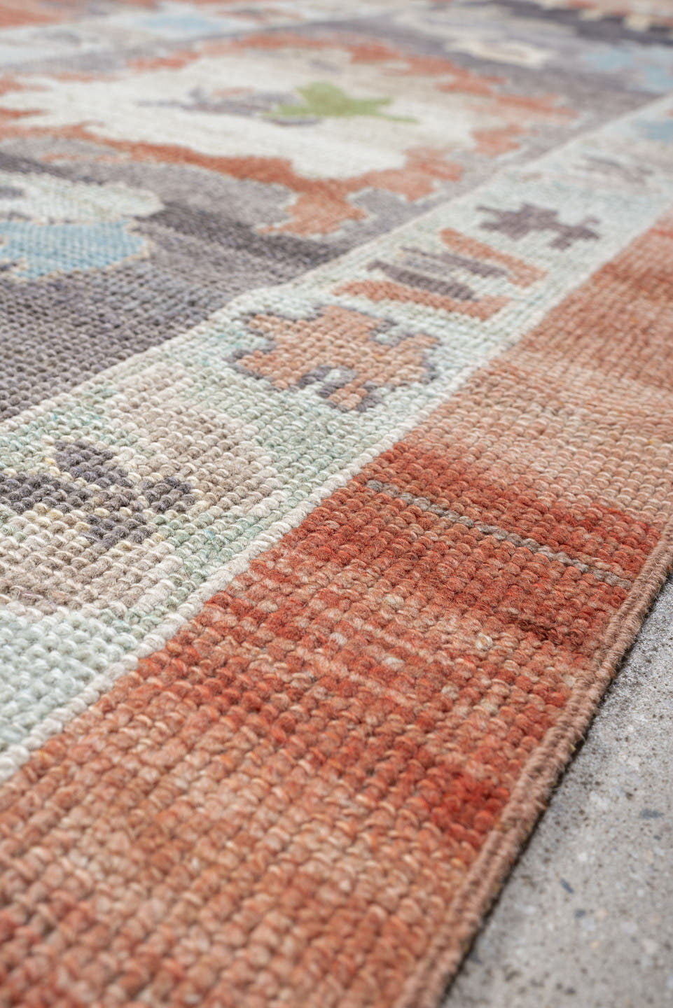 12' x 15' one-of-a-kind handmade vintage Oushak oversize rug. Color palette: coral, slate, ivory, sky blue, sage, taupe