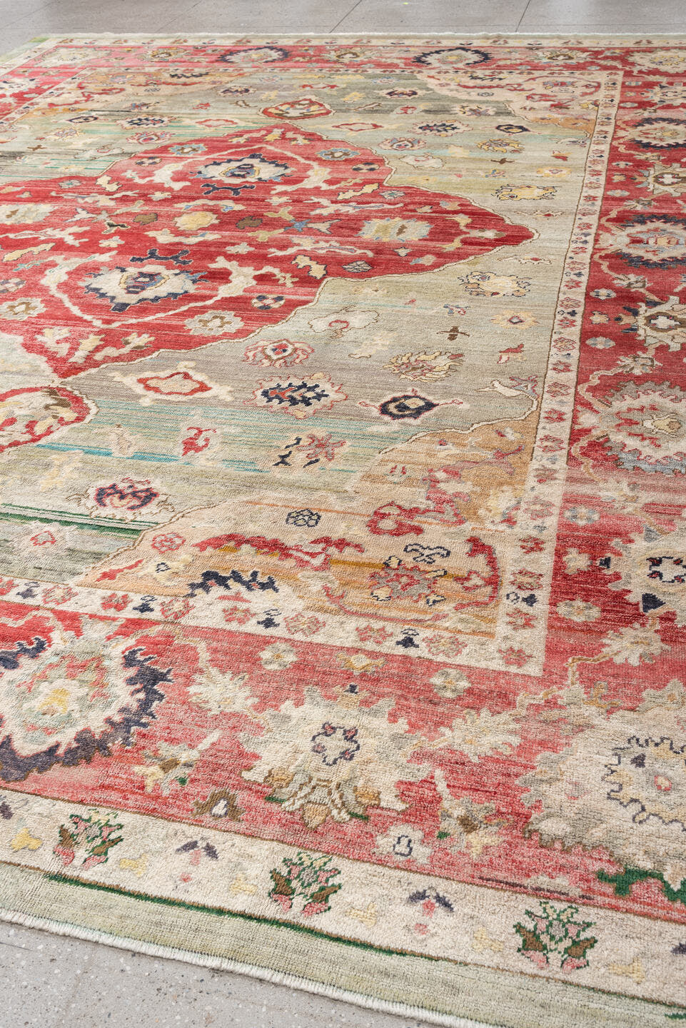 12' x 15' one-of-a-kind handmade vintage Oushak oversize rug. Color palette: terracotta, sage, ivory, rust, cream, navy