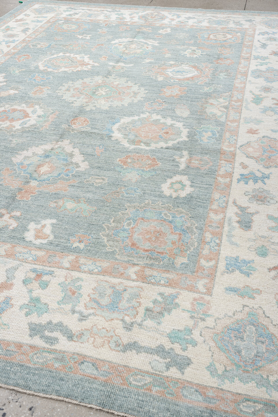 9' x 12' one-of-a-kind handmade vintage Oushak large size rug. Color palette: pale blue, ivory, blush, sage, peach, taupe