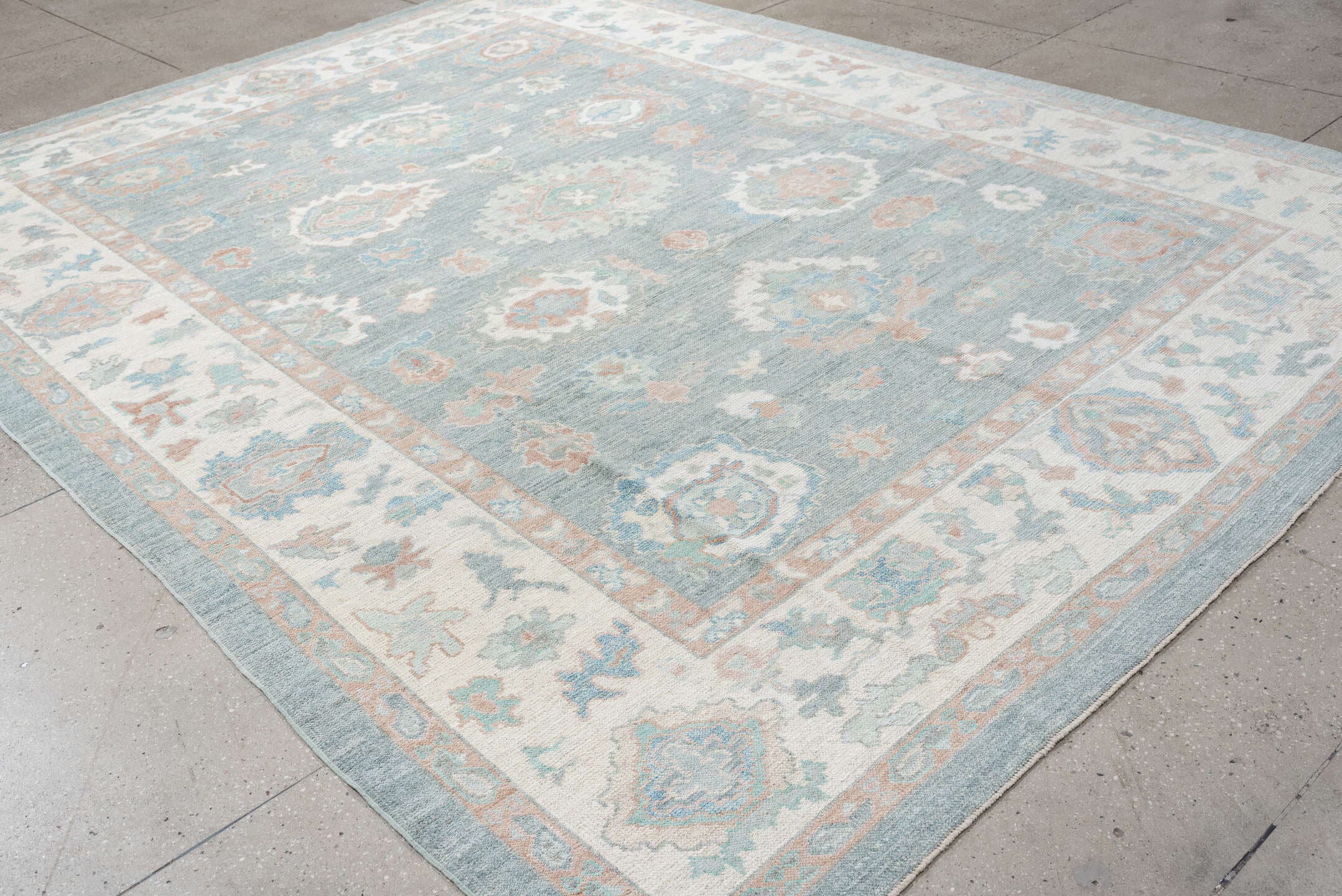 9' x 12' one-of-a-kind handmade vintage Oushak large size rug. Color palette: pale blue, ivory, blush, sage, peach, taupe