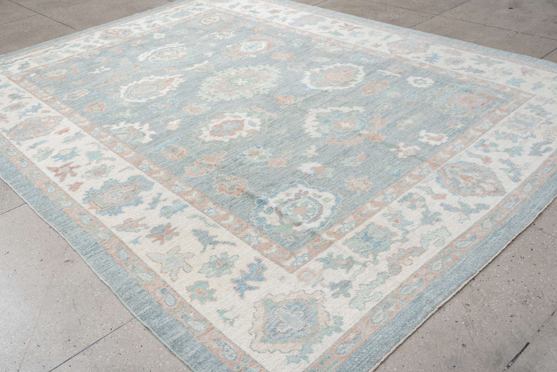 9' x 12' one-of-a-kind handmade vintage Oushak large size rug. Color palette: pale blue, ivory, blush, sage, peach, taupe