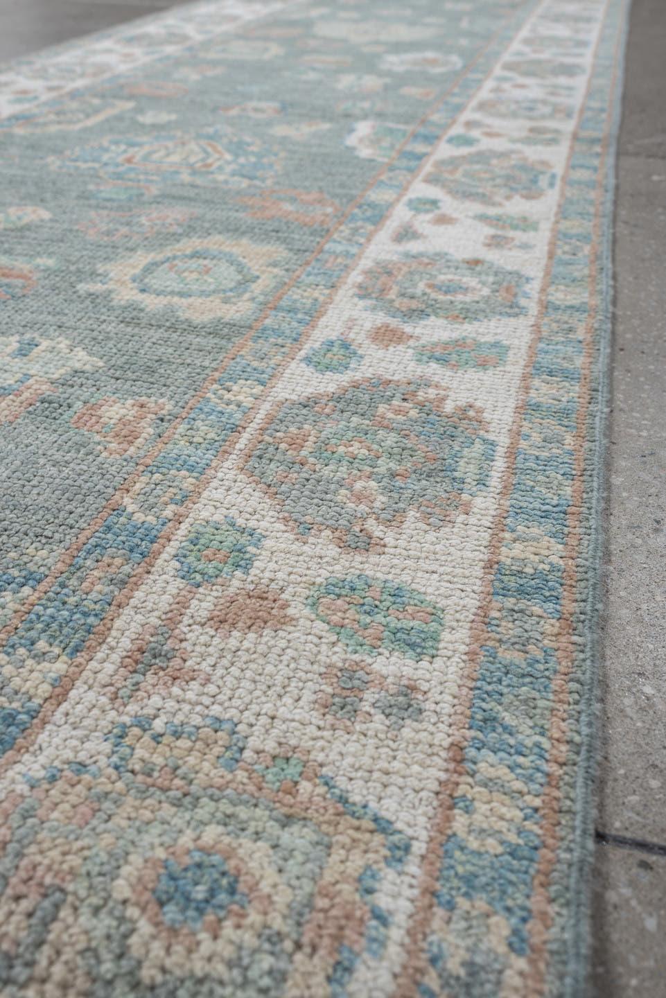 2' x 14' one-of-a-kind handmade vintage Oushak runner rug. Color palette: light blue, ivory, taupe, sage, peach, beige, gray