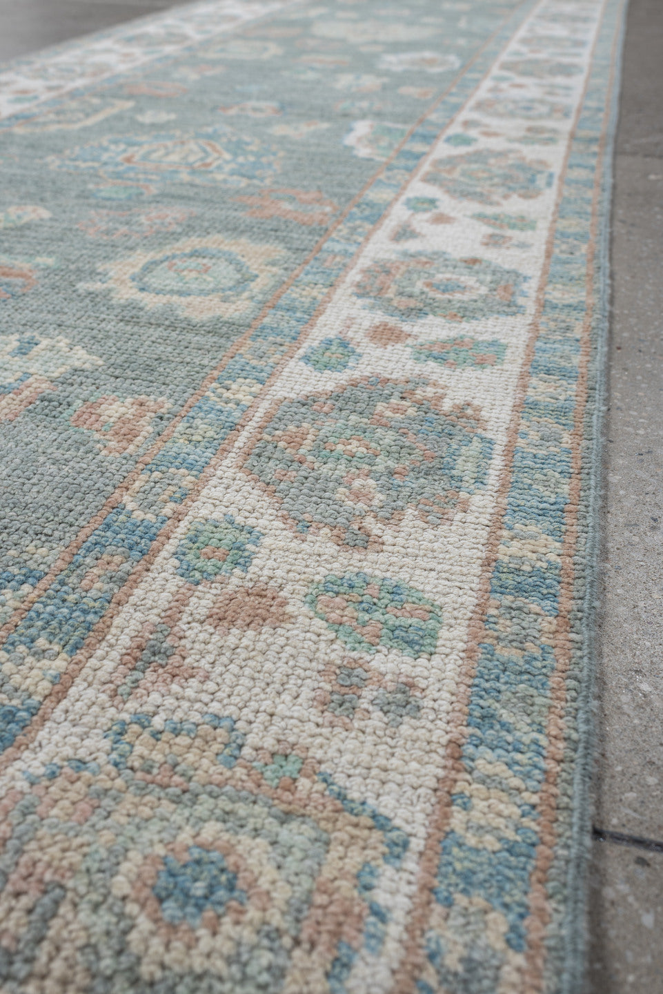2' x 14' one-of-a-kind handmade vintage Oushak runner rug. Color palette: light blue, ivory, taupe, sage, peach, beige, gray