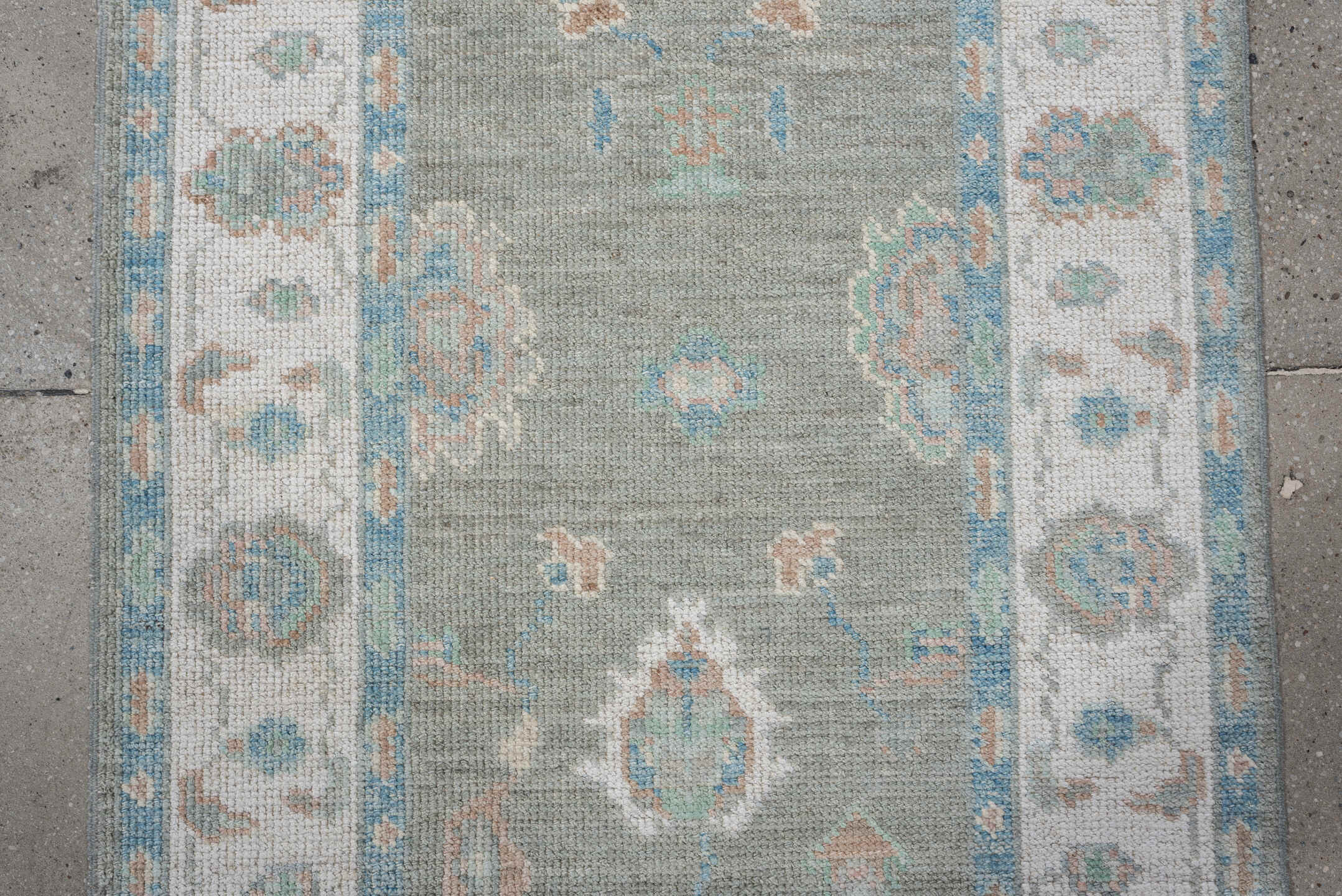 3' x 12' one-of-a-kind handmade vintage Oushak runner rug. Color palette: sage, ivory, aqua, blush, taupe, cream, green