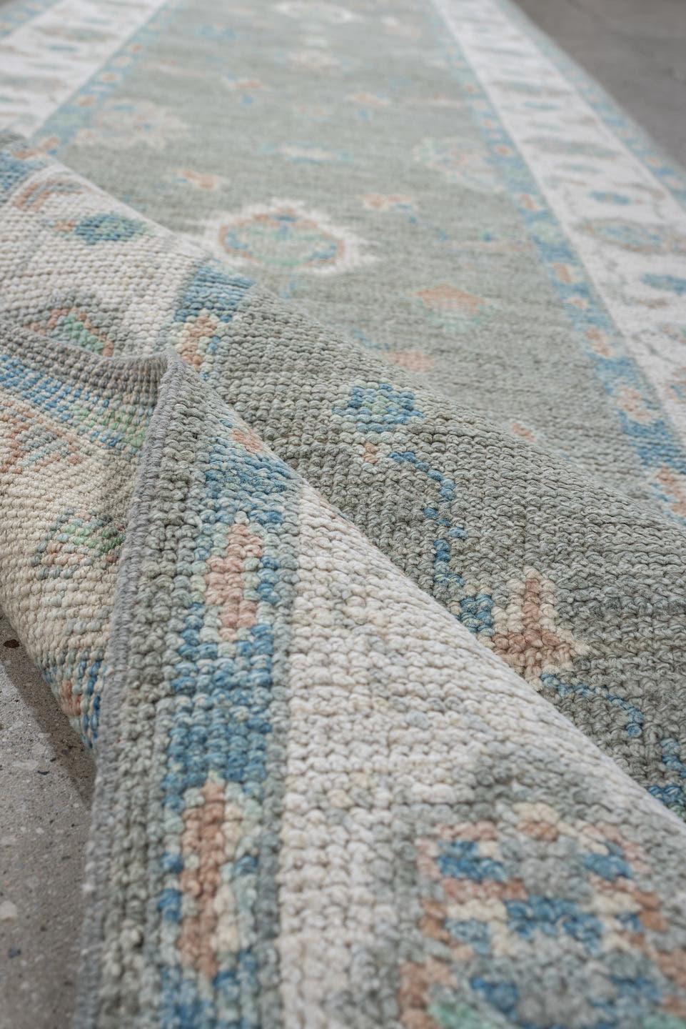 3' x 12' one-of-a-kind handmade vintage Oushak runner rug. Color palette: sage, ivory, aqua, blush, taupe, cream, green