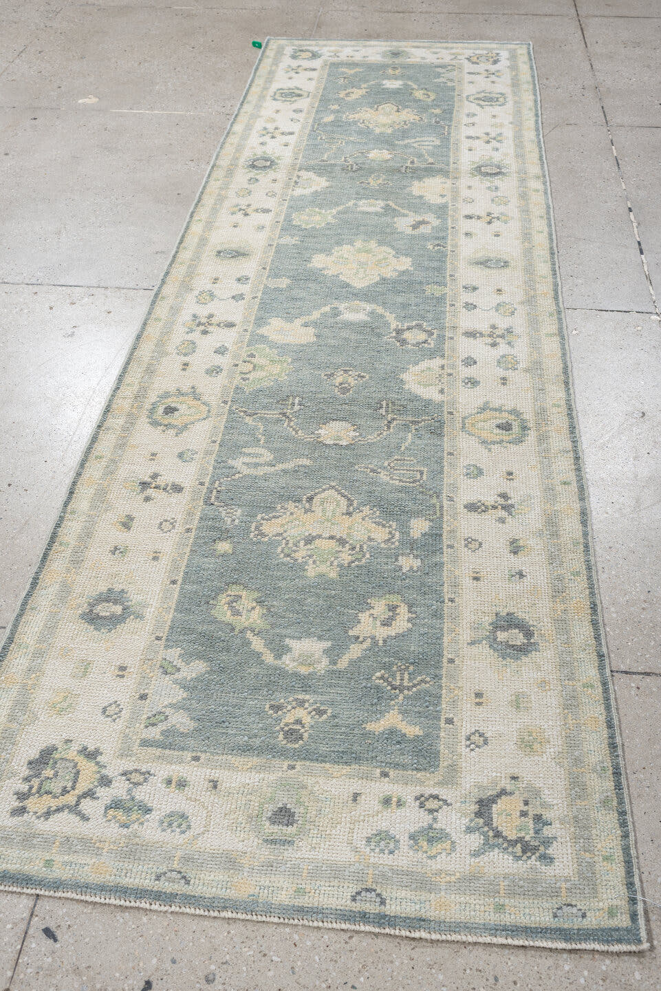 3' x 9' one-of-a-kind handmade vintage Oushak runner rug. Color palette: pale blue, ivory, sage, taupe, slate, cream