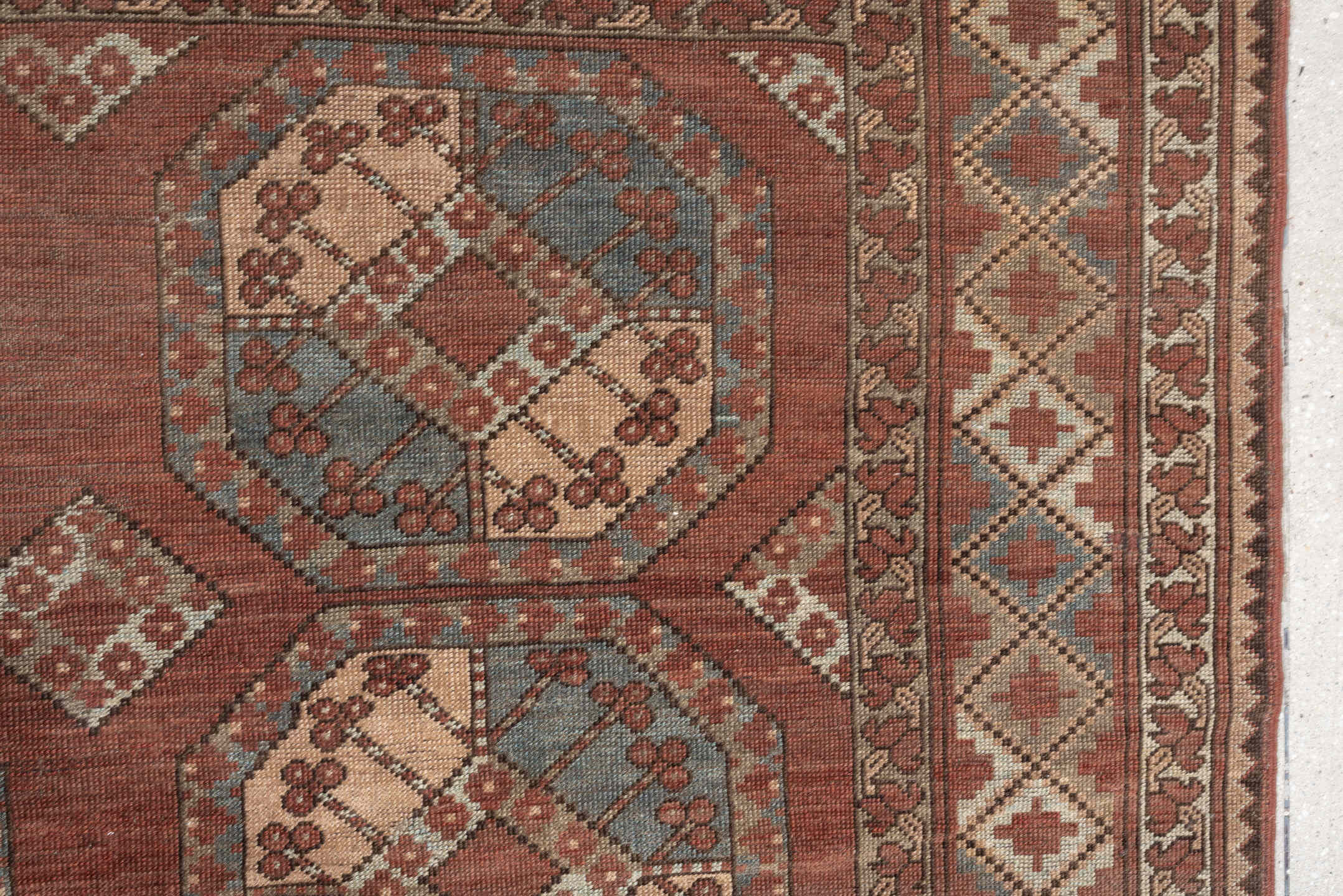 7' x 9' one-of-a-kind handmade vintage Afghan rug. Color palette: terracotta, ivory, blue gray, rust, taupe, camel, brown