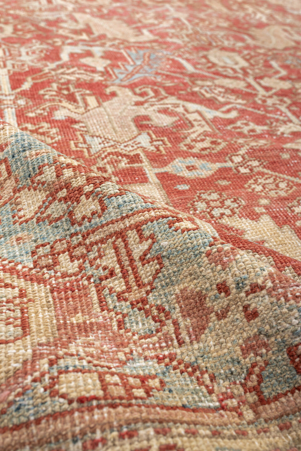 7' x 9' one-of-a-kind handmade vintage Heriz large size rug. Color palette: terracotta, ivory, sky blue, camel, rust, taupe