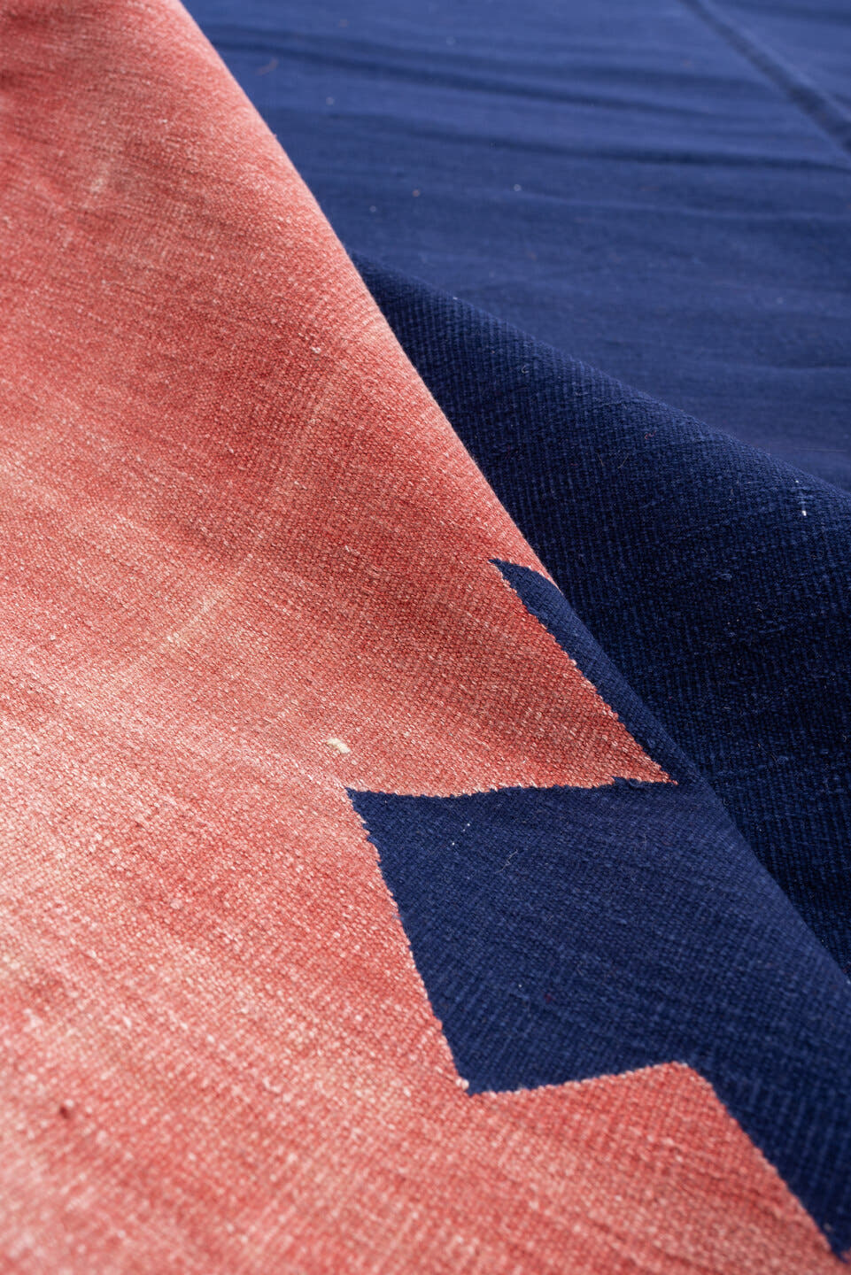 9' x 15' one-of-a-kind handmade antique Cot Dhurrie rug. Color palette: indigo, coral, rose, navy, ivory, purple, terracotta