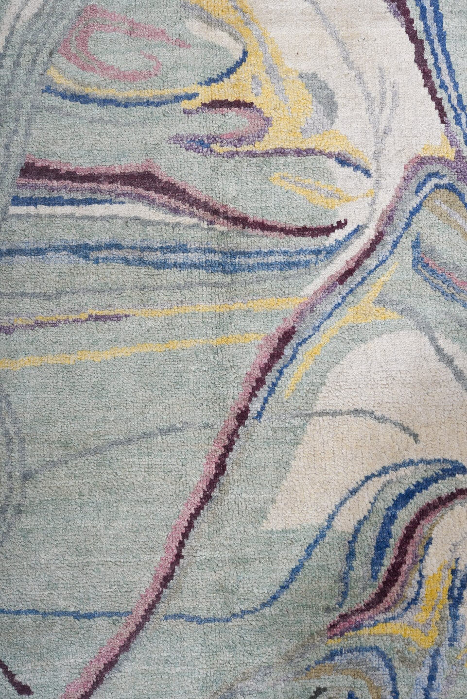 6' x 9' one-of-a-kind handmade handmade Contemporary medium size rug. Color palette: aqua, ivory, blue, plum, pink