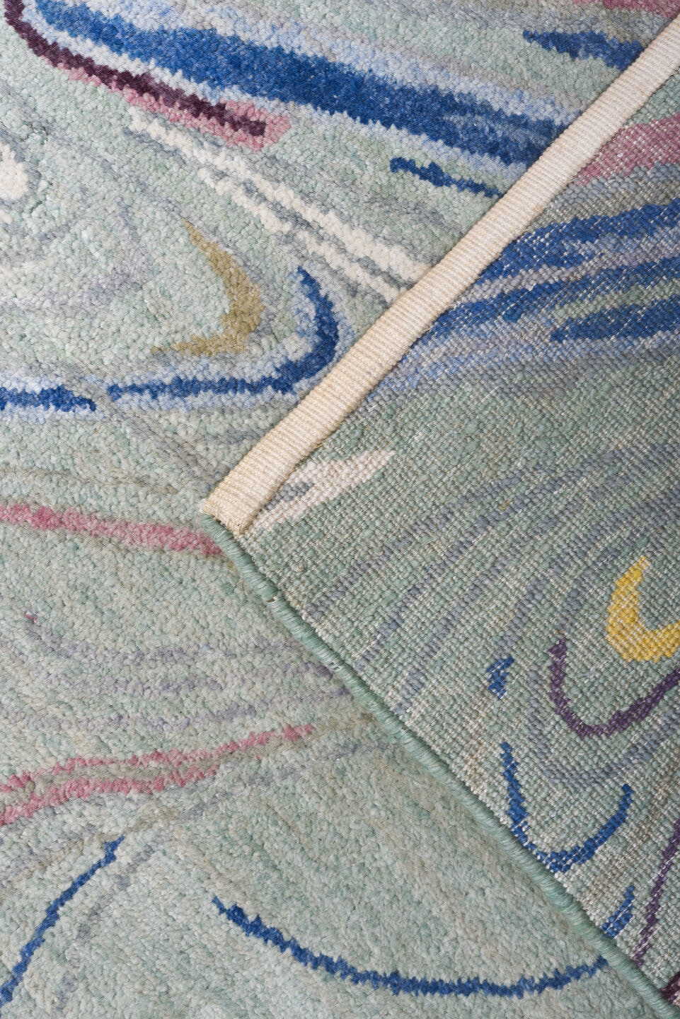 6' x 9' one-of-a-kind handmade handmade Contemporary medium size rug. Color palette: aqua, ivory, blue, plum, pink