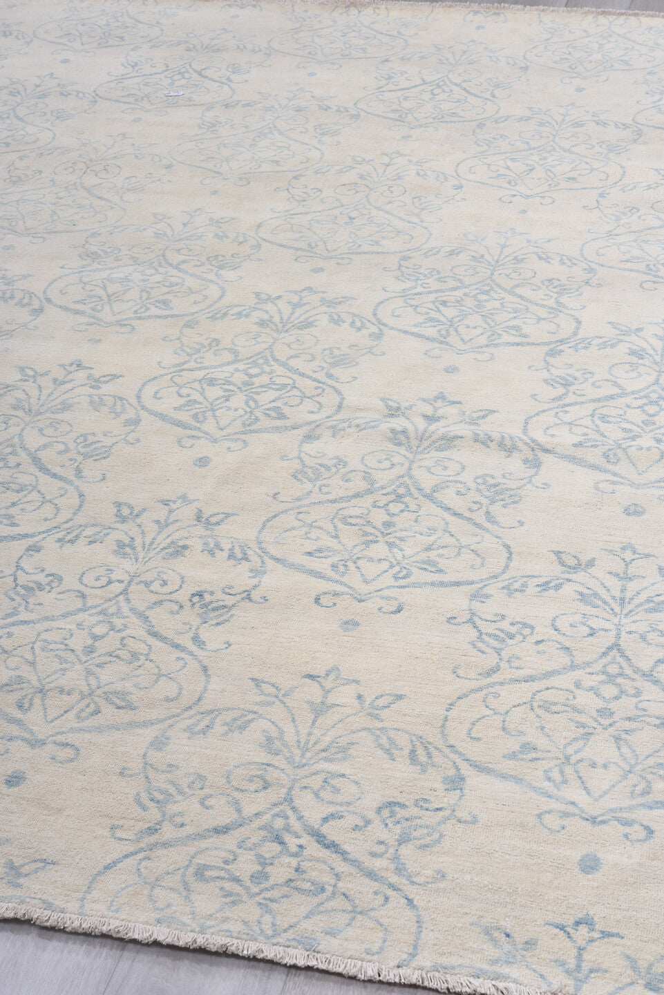 8' x 11' one-of-a-kind handmade vintage European large size rug. Color palette: ivory, pale blue, cream, sky blue, taupe