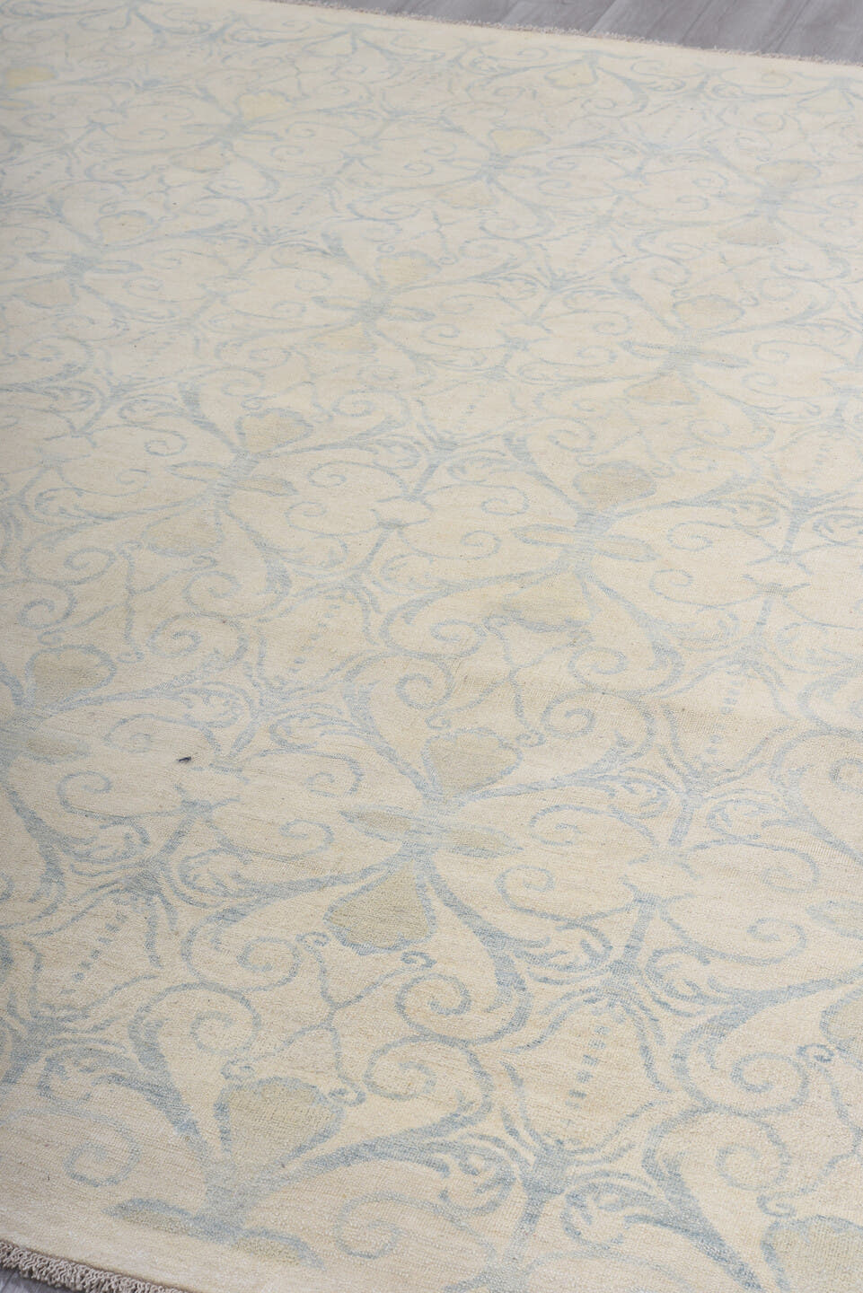 8' x 9' one-of-a-kind handmade vintage European rug. Color palette: ivory, pale blue, cream, beige, light blue