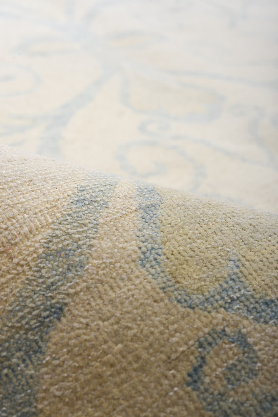 8' x 9' one-of-a-kind handmade vintage European rug. Color palette: ivory, pale blue, cream, beige, light blue