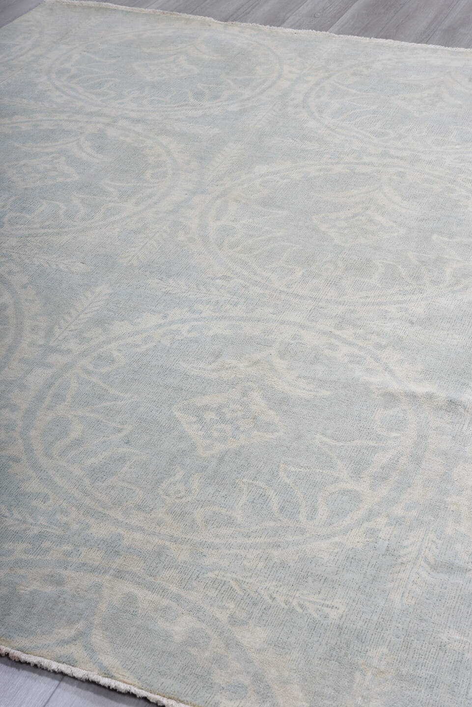 7' x 9' one-of-a-kind handmade vintage European rug. Color palette: pale blue, ivory, cream, silver, taupe, light blue, gray