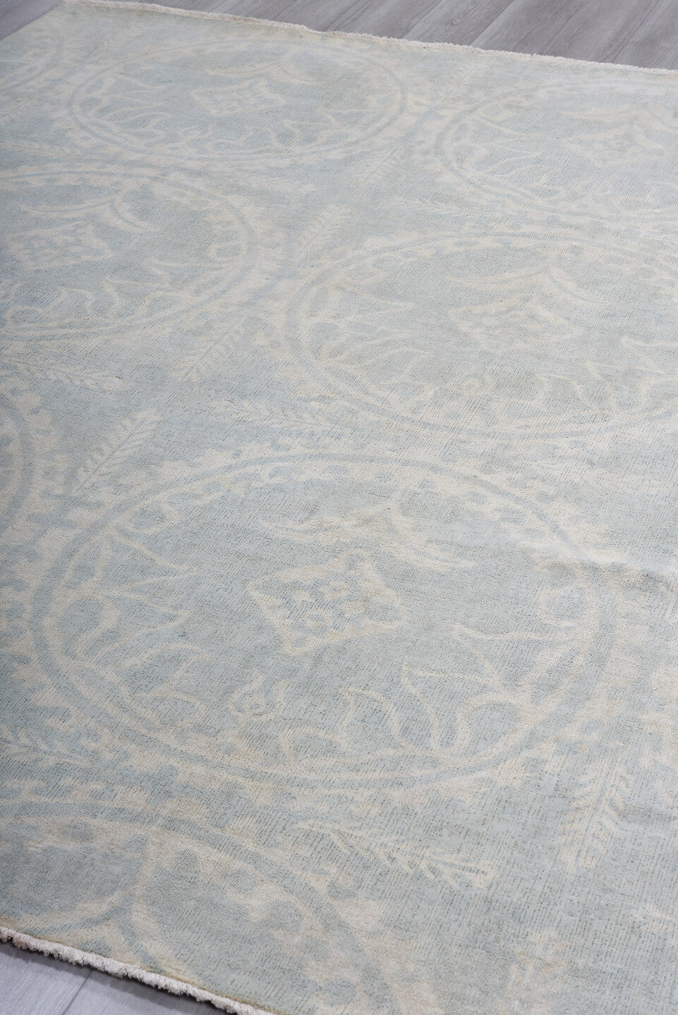 7' x 9' one-of-a-kind handmade vintage European rug. Color palette: pale blue, ivory, cream, silver, taupe, light blue, gray