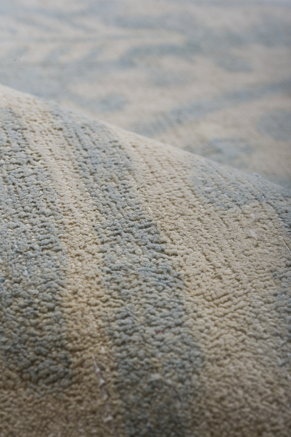 7' x 9' one-of-a-kind handmade vintage European rug. Color palette: pale blue, ivory, cream, silver, taupe, light blue, gray