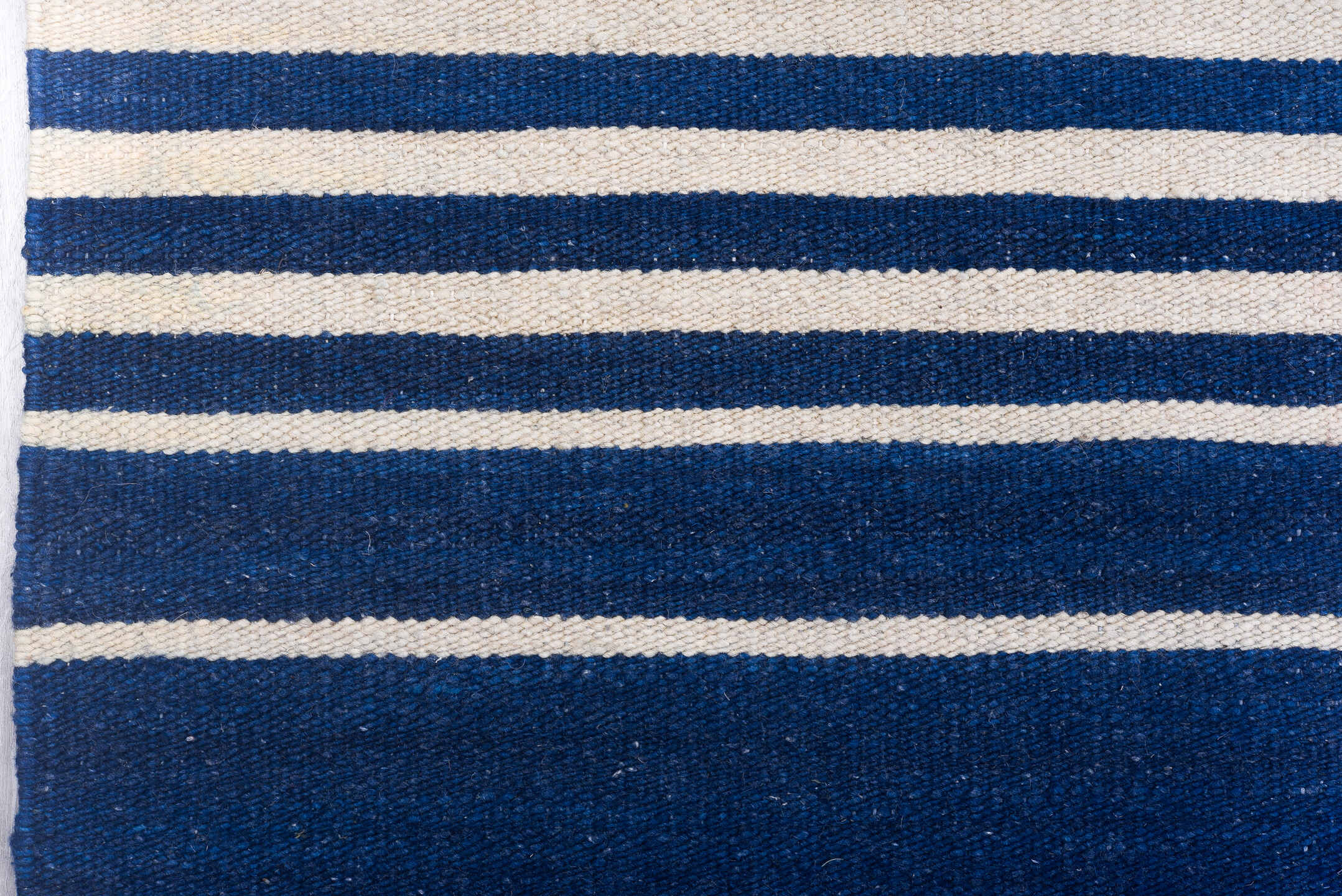 7' x 9' one-of-a-kind handmade vintage Kilim rug. Color palette: indigo, ivory, purple