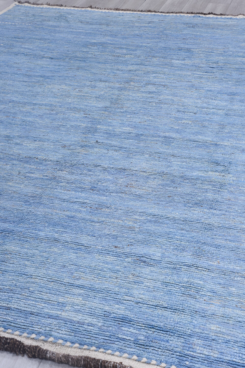 9' x 12' one-of-a-kind handmade vintage Tulu large size rug. Color palette: sky blue, ivory, slate, taupe, light blue, gray