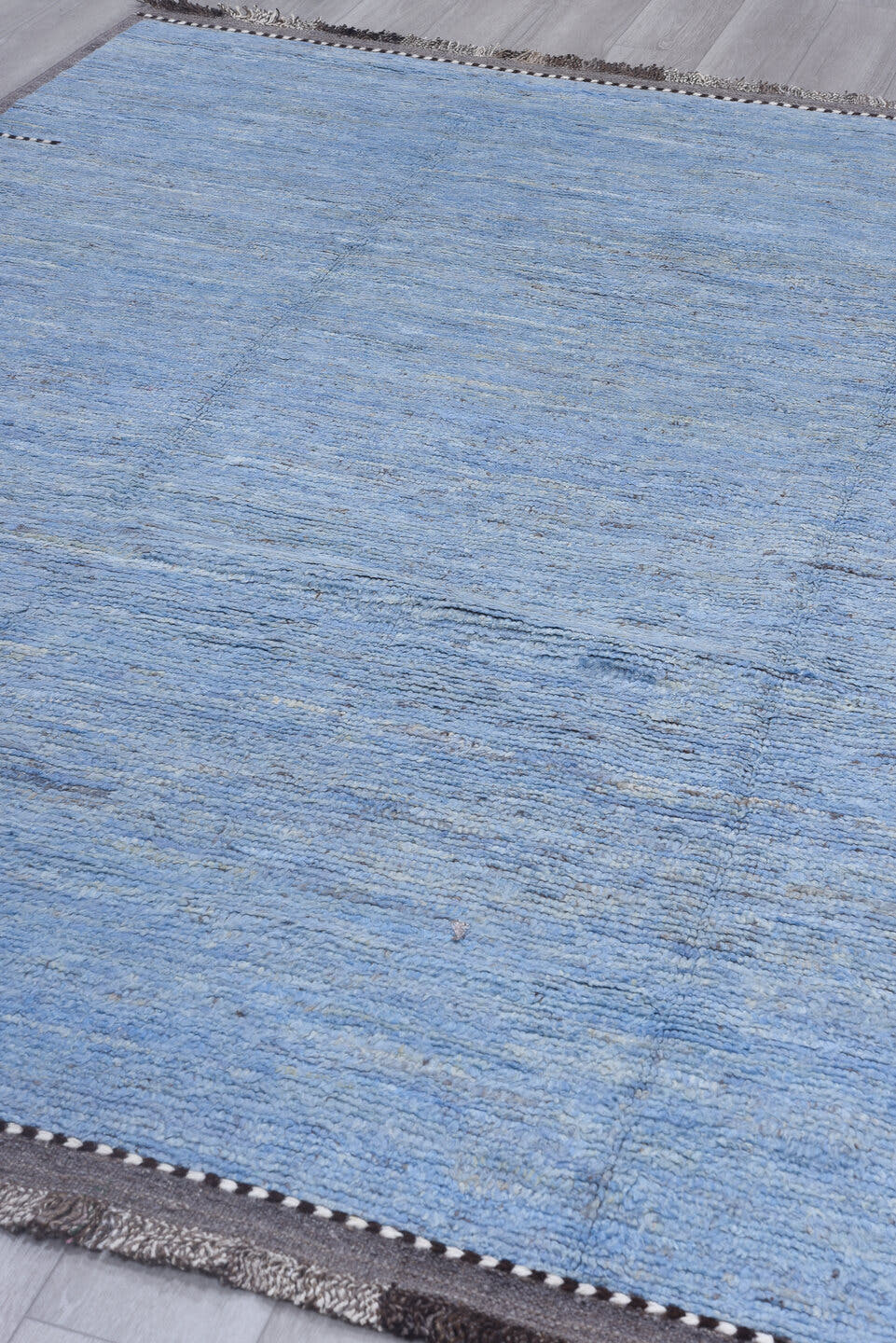 8' x 9' one-of-a-kind handmade vintage Tulu rug. Color palette: sky blue, taupe, ivory, slate, charcoal, light blue, beige
