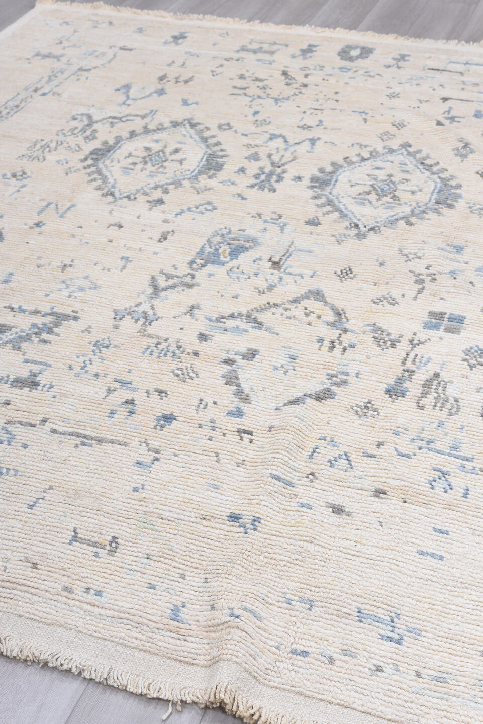 8' x 9' one-of-a-kind handmade vintage Tulu rug. Color palette: ivory, pale blue, light gray, cream, taupe, light blue