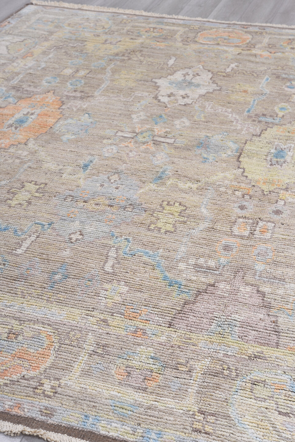8' x 9' one-of-a-kind handmade vintage Tulu rug. Color palette: taupe, ivory, pale blue, beige, gold, blush, gray, camel