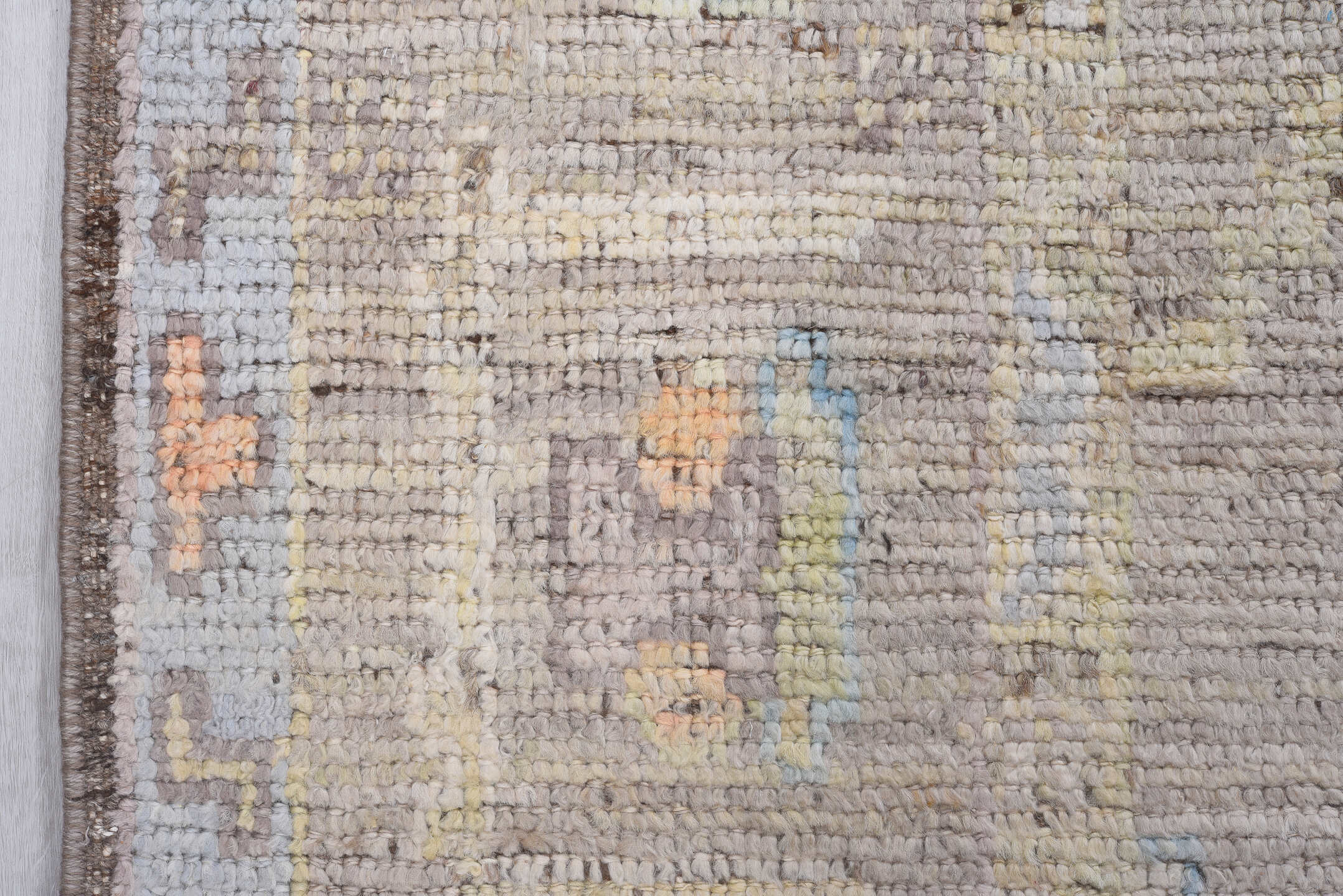 8' x 9' one-of-a-kind handmade vintage Tulu rug. Color palette: taupe, ivory, pale blue, beige, gold, blush, gray, camel