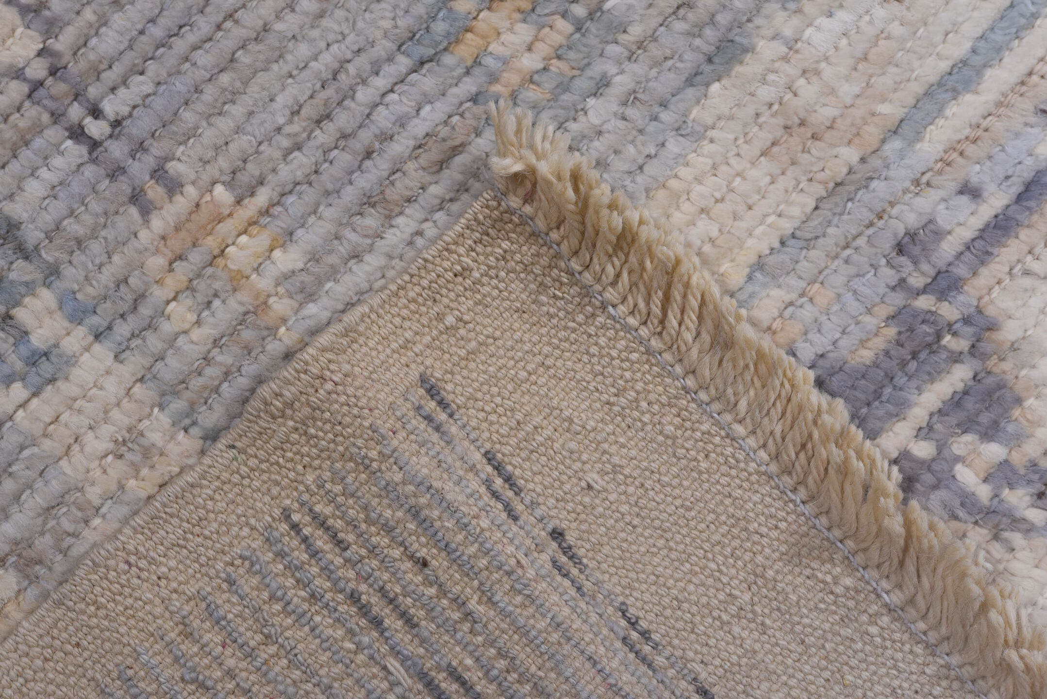 9' x 13' one-of-a-kind handmade vintage Tulu large size rug. Color palette: ivory, pale blue, lavender, cream, taupe