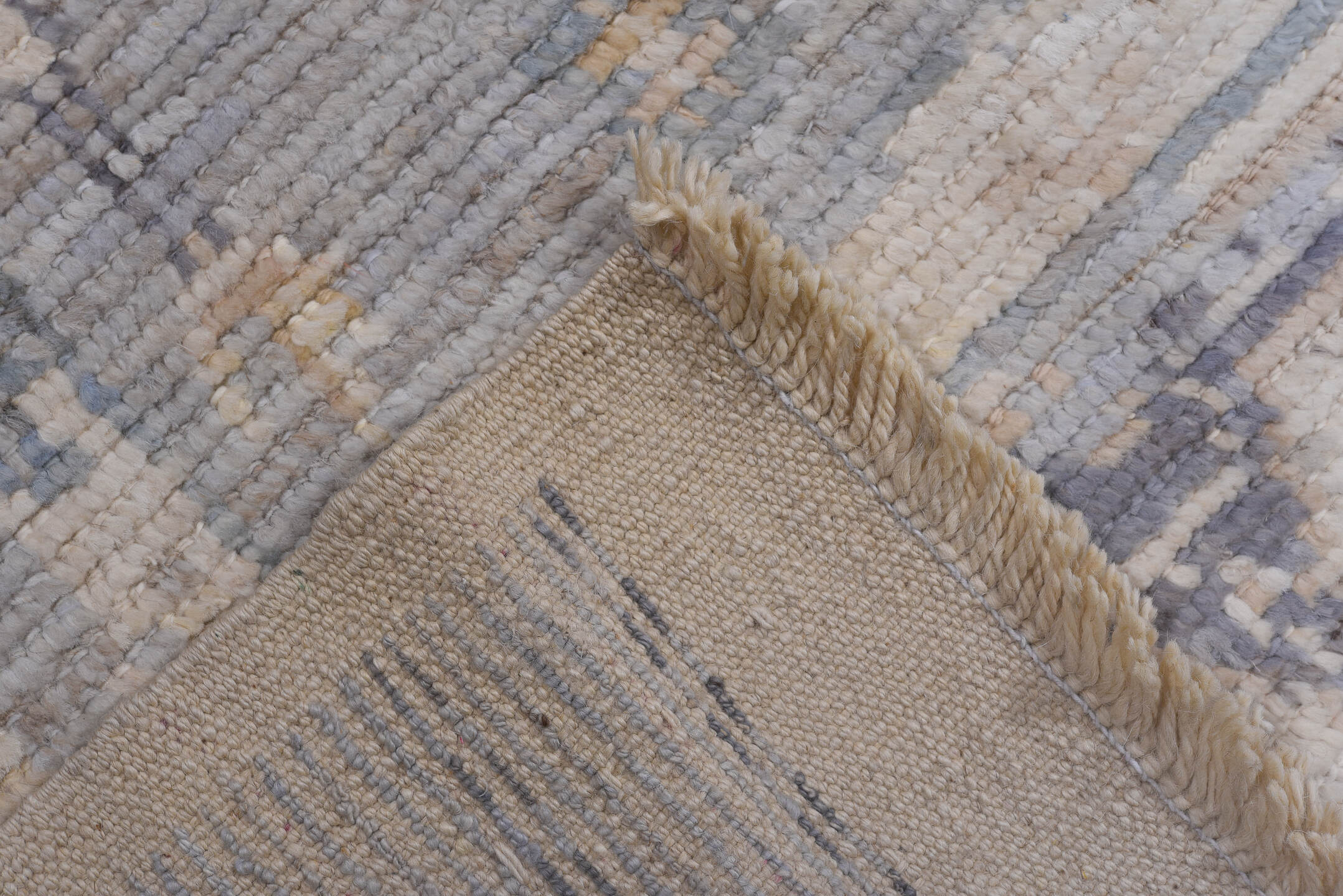 9' x 13' one-of-a-kind handmade vintage Tulu large size rug. Color palette: ivory, pale blue, lavender, cream, taupe