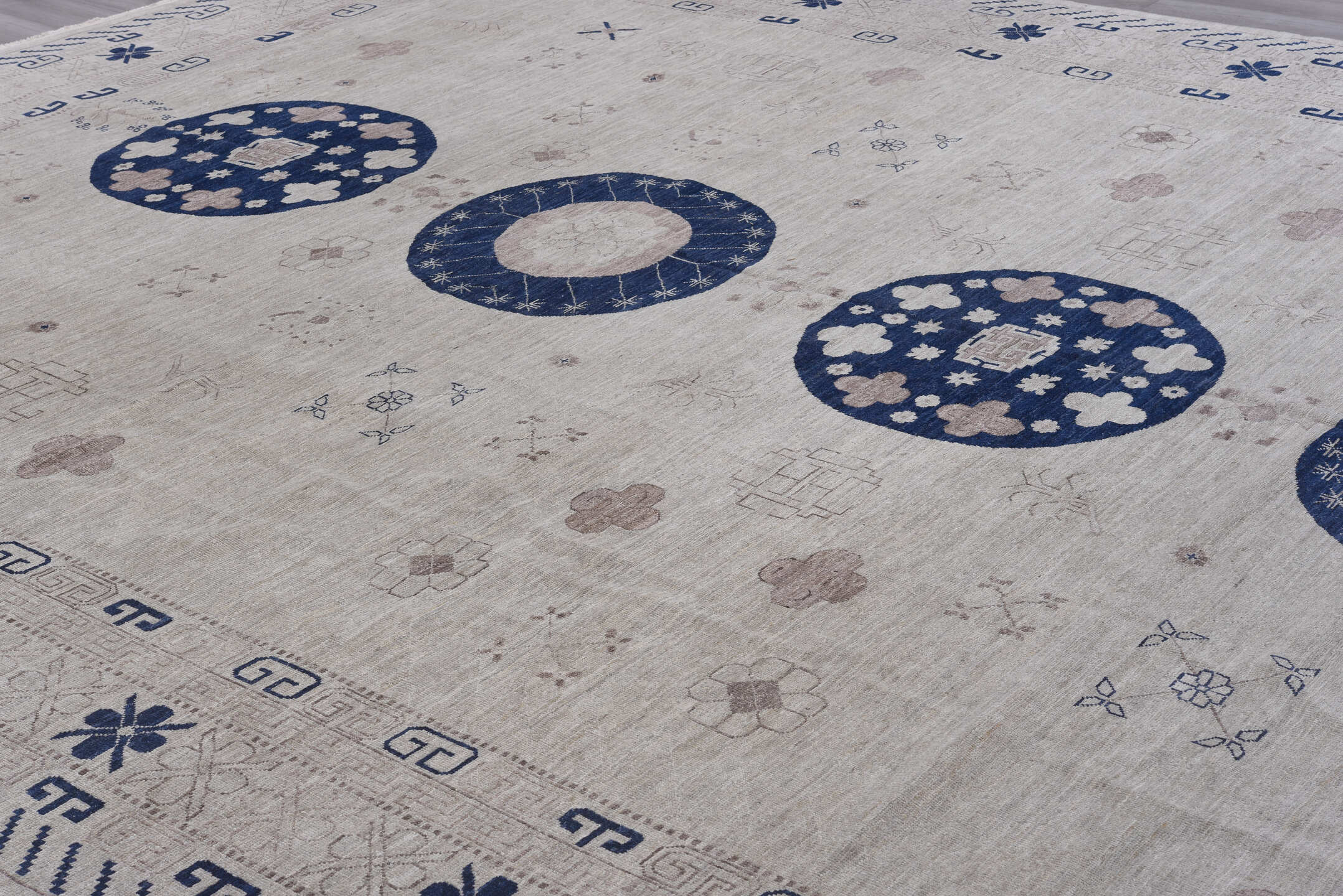 12' x 19' one-of-a-kind handmade vintage Khotan oversize rug. Color palette: ivory, cobalt, taupe, beige, slate, blue, gray