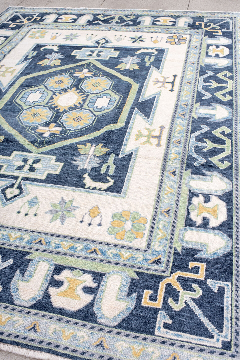 8' x 10' one-of-a-kind handmade vintage Oushak large size rug. Color palette: ivory, navy, sky_blue, sage, gold, pale_blue