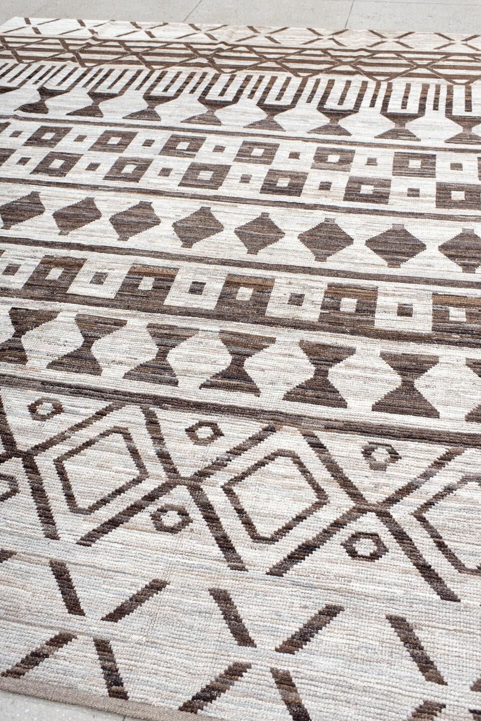 9' x 12' one-of-a-kind handmade vintage Tulu large size rug. Color palette: ivory, brown, taupe, beige, gray