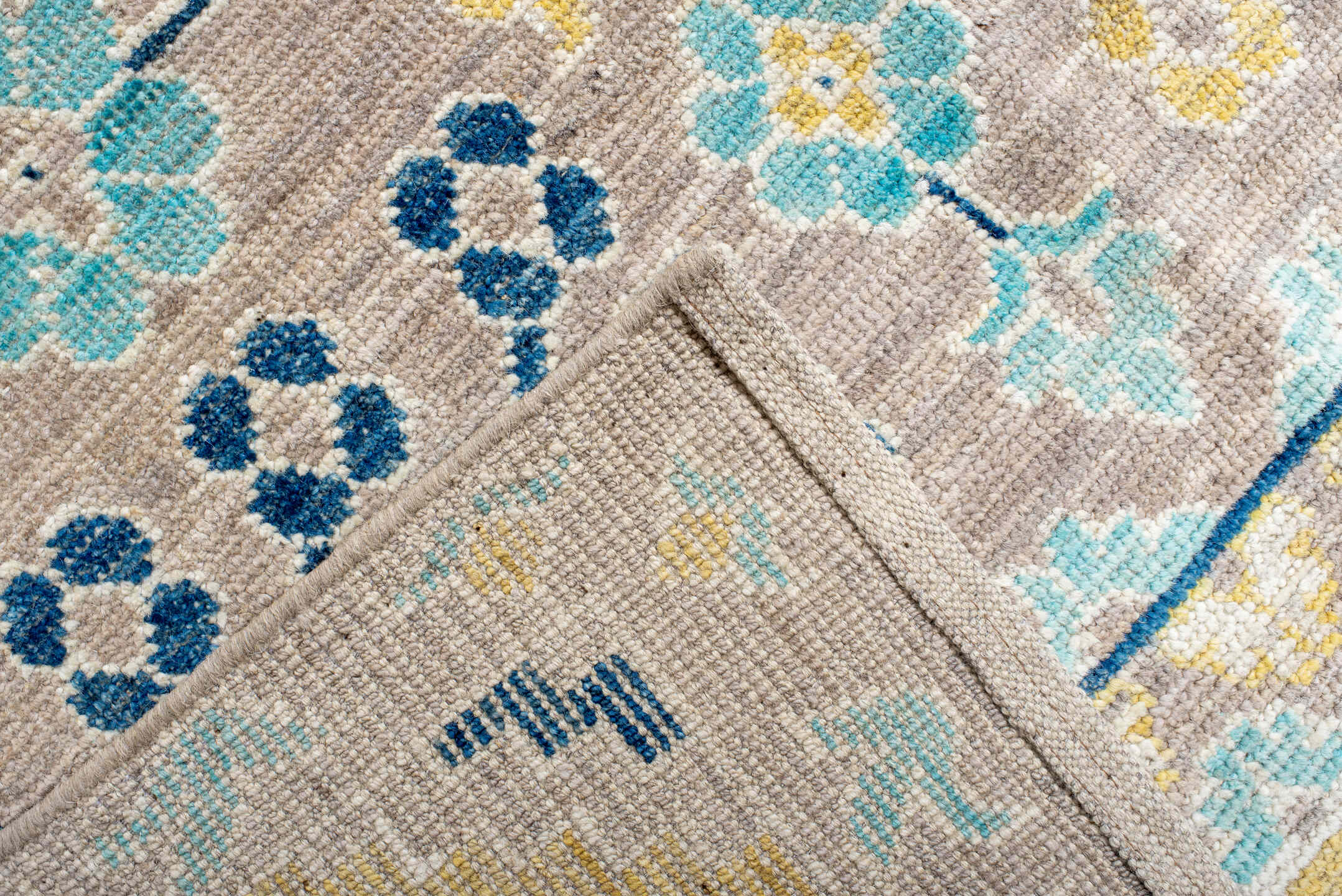 9' x 12' one-of-a-kind handmade vintage Khotan large size rug. Color palette: antiquewhite, blue, brown, cornsilk, dark gray