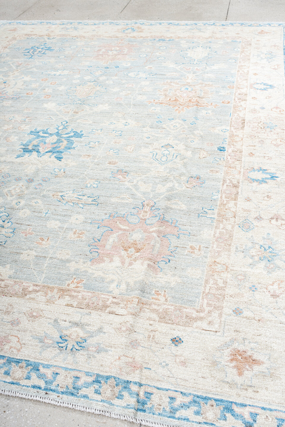 8' x 10' one-of-a-kind handmade vintage Oushak large size rug. Color palette: ivory, pale blue, blush, cream, sky blue