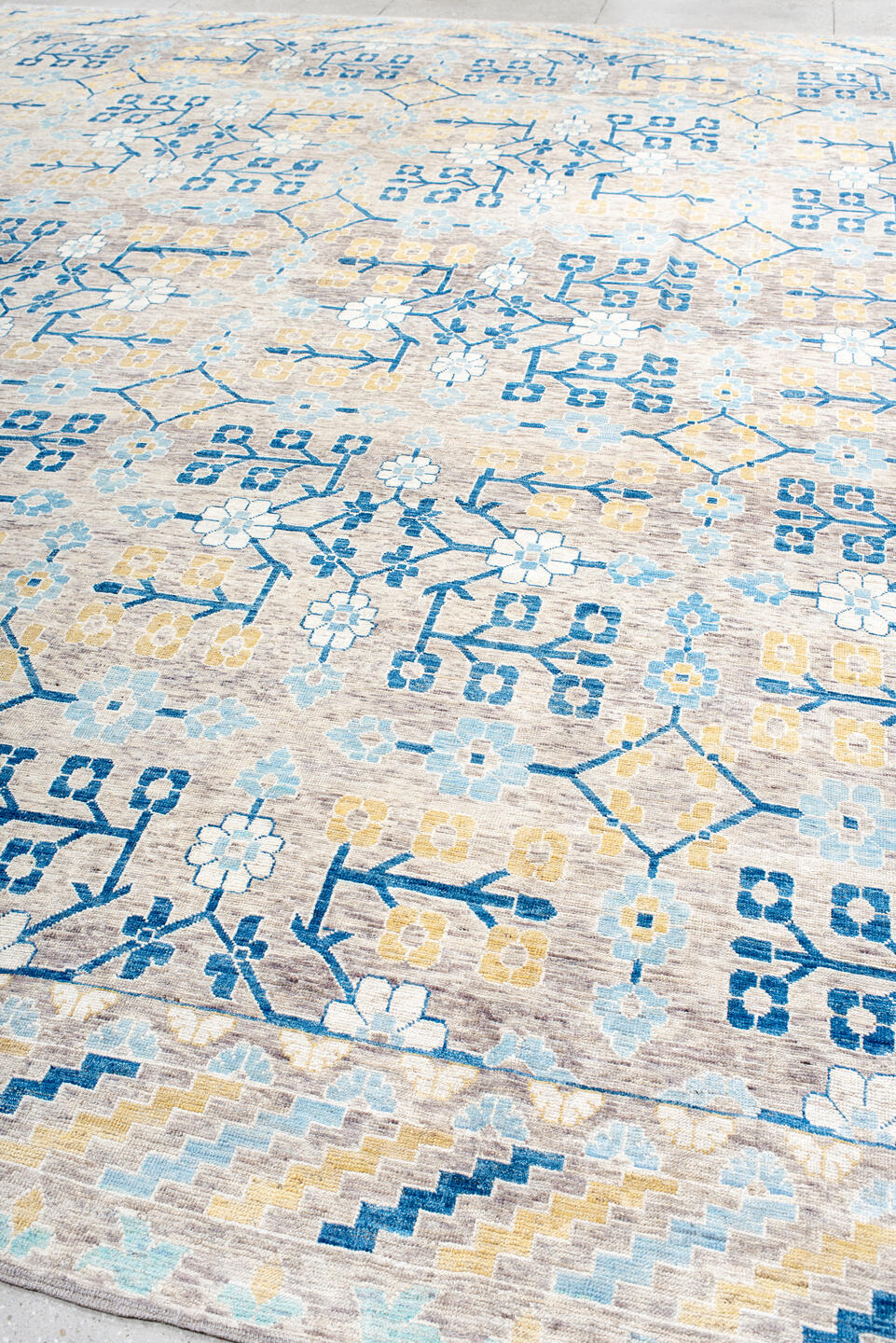 13' x 17' one-of-a-kind handmade vintage Khotan oversize rug. Color palette: ivory, light blue, cobalt, gold, taupe, blue