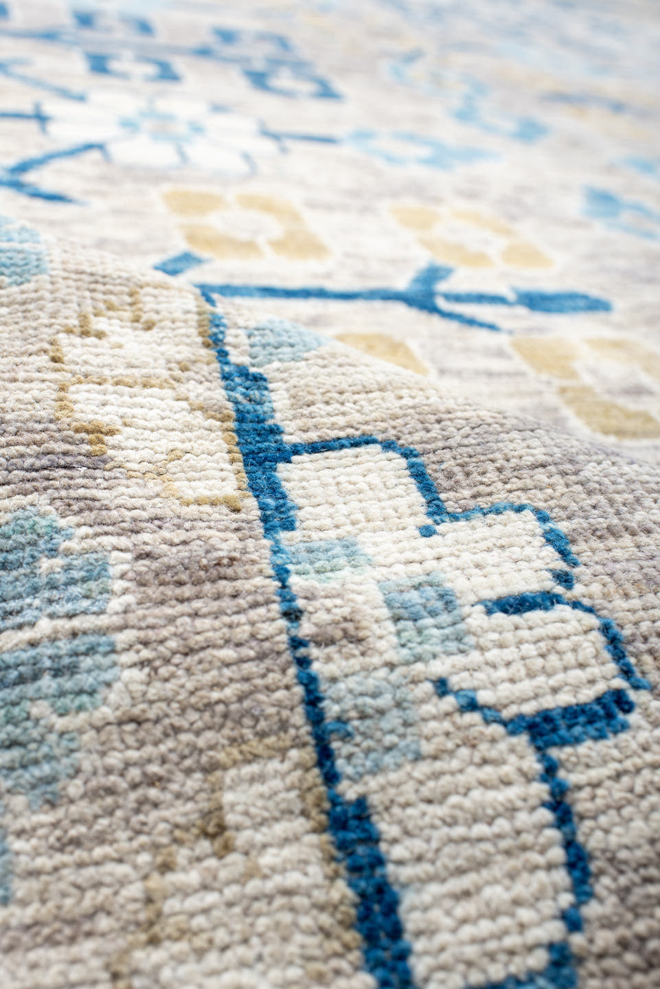13' x 17' one-of-a-kind handmade vintage Khotan oversize rug. Color palette: ivory, light blue, cobalt, gold, taupe, blue
