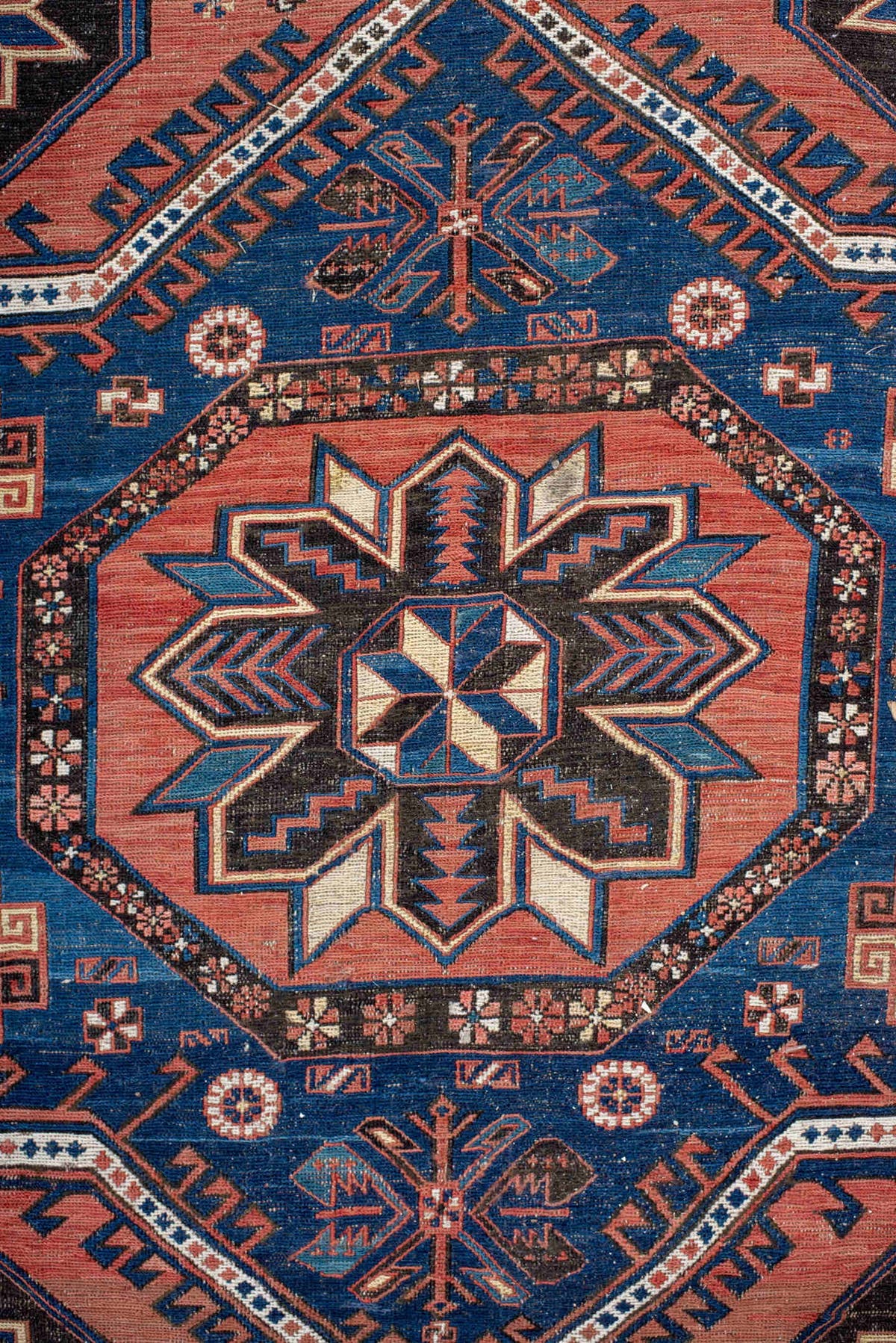 7' x 12' one-of-a-kind handmade vintage Sumak large size rug. Color palette: rust, indigo, navy, ivory, burgundy, teal
