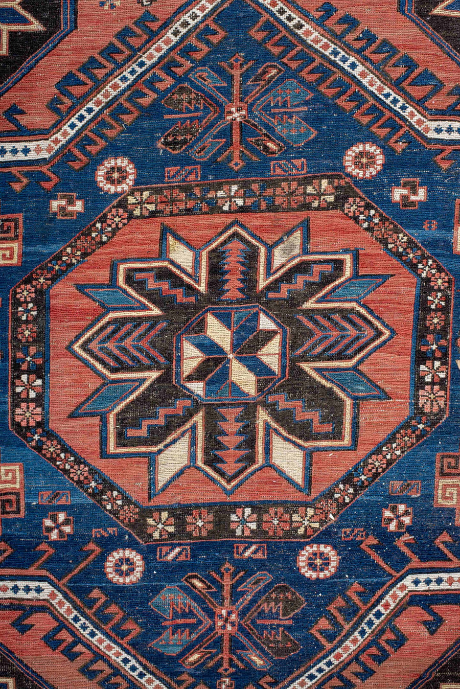 7' x 12' one-of-a-kind handmade vintage Sumak large size rug. Color palette: rust, indigo, navy, ivory, burgundy, teal