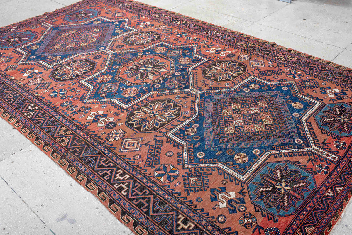7' x 12' one-of-a-kind handmade vintage Sumak large size rug. Color palette: rust, indigo, navy, ivory, burgundy, teal
