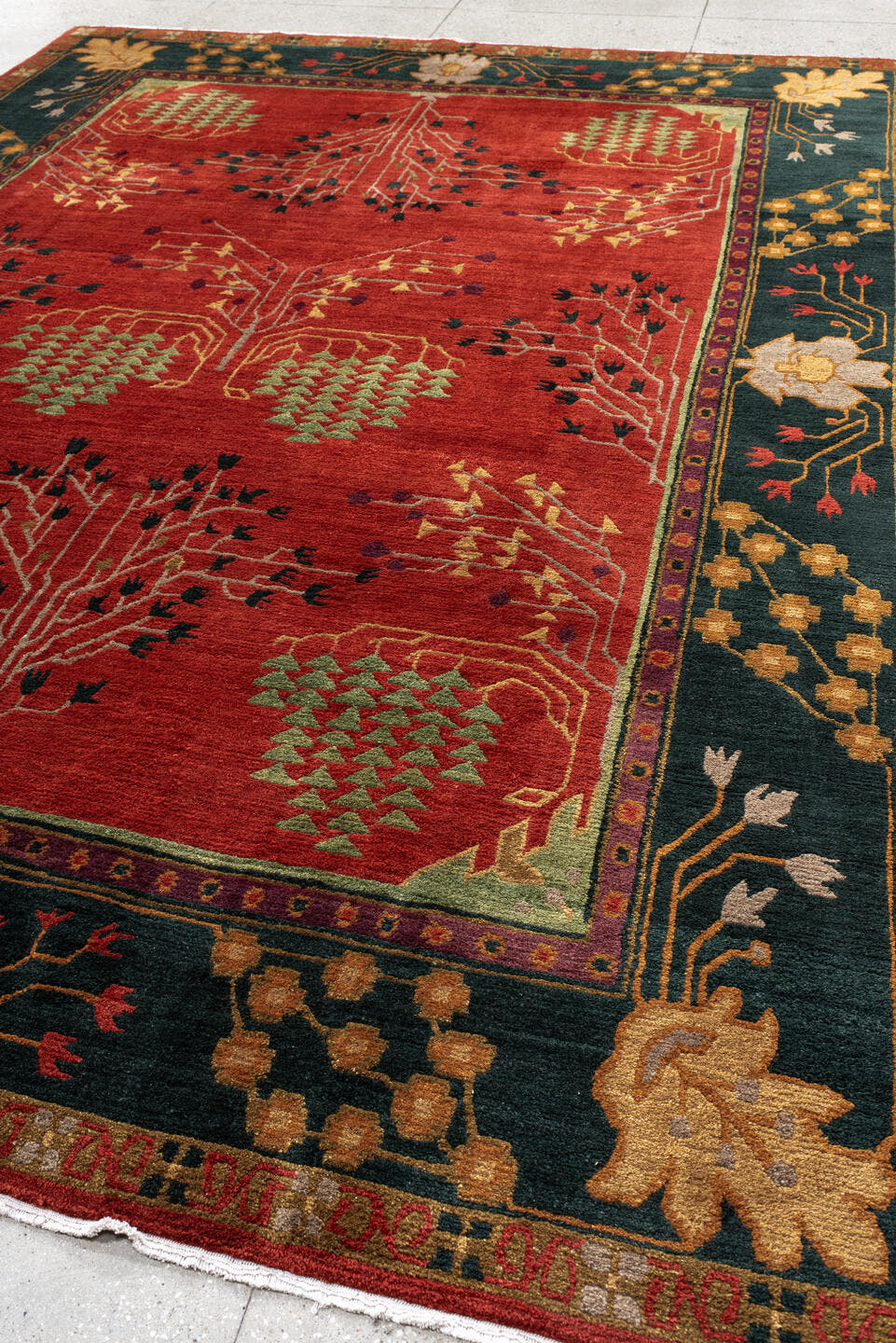 9' x 13' one-of-a-kind handmade vintage Donegal large size rug. Color palette: rust, navy, ivory, sage, peach, burgundy